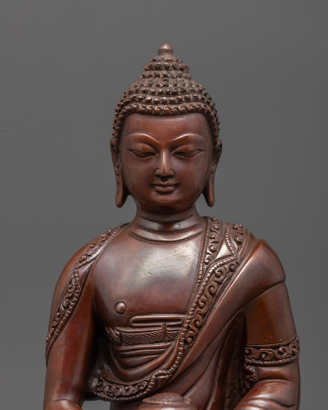 Close-up of Amida Buddha’s serene face and detailed crown