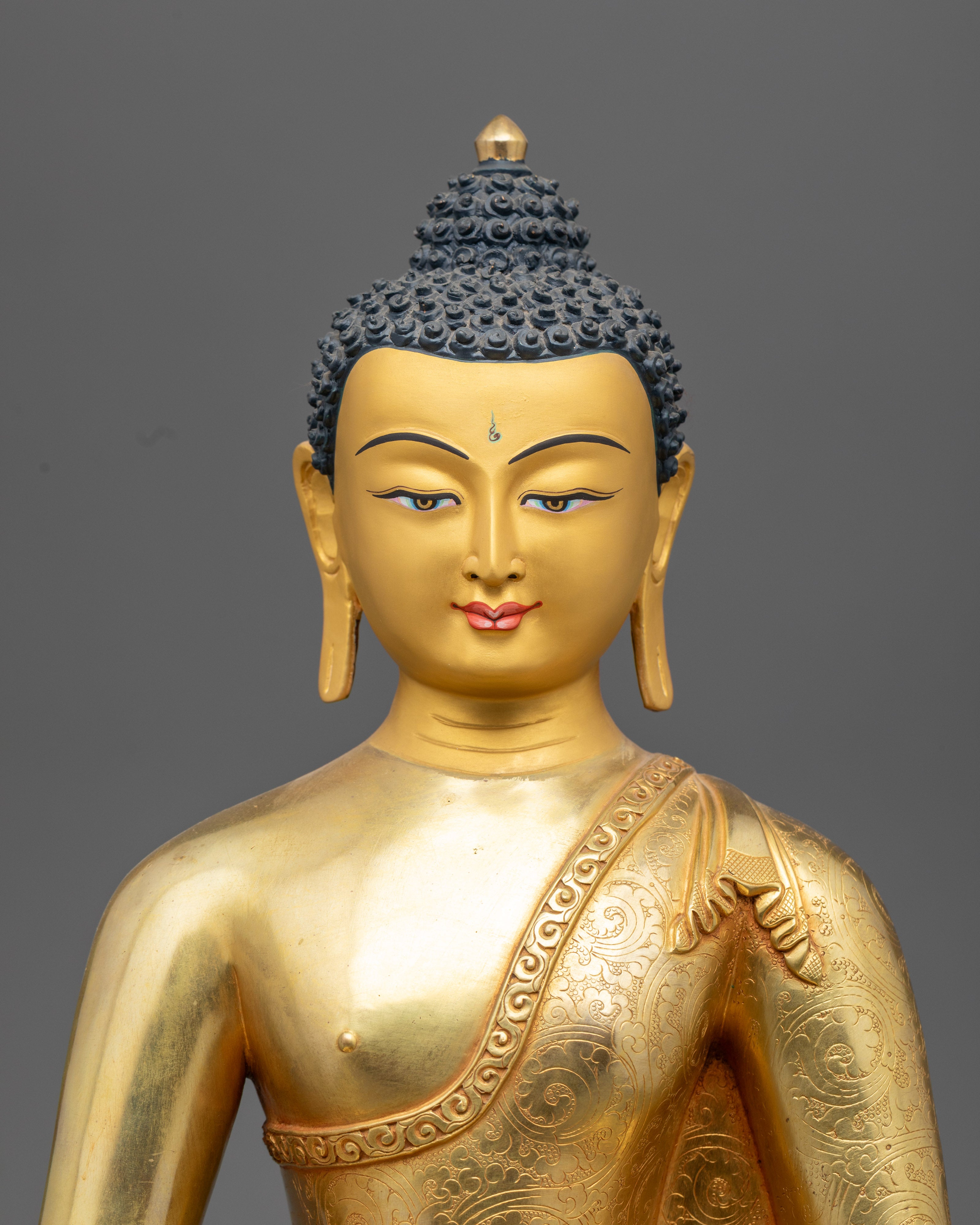 Amitabha Buddha’s serene face and upper body, showcasing detailed facial features, gold gilding, and vibrant acrylic colors.