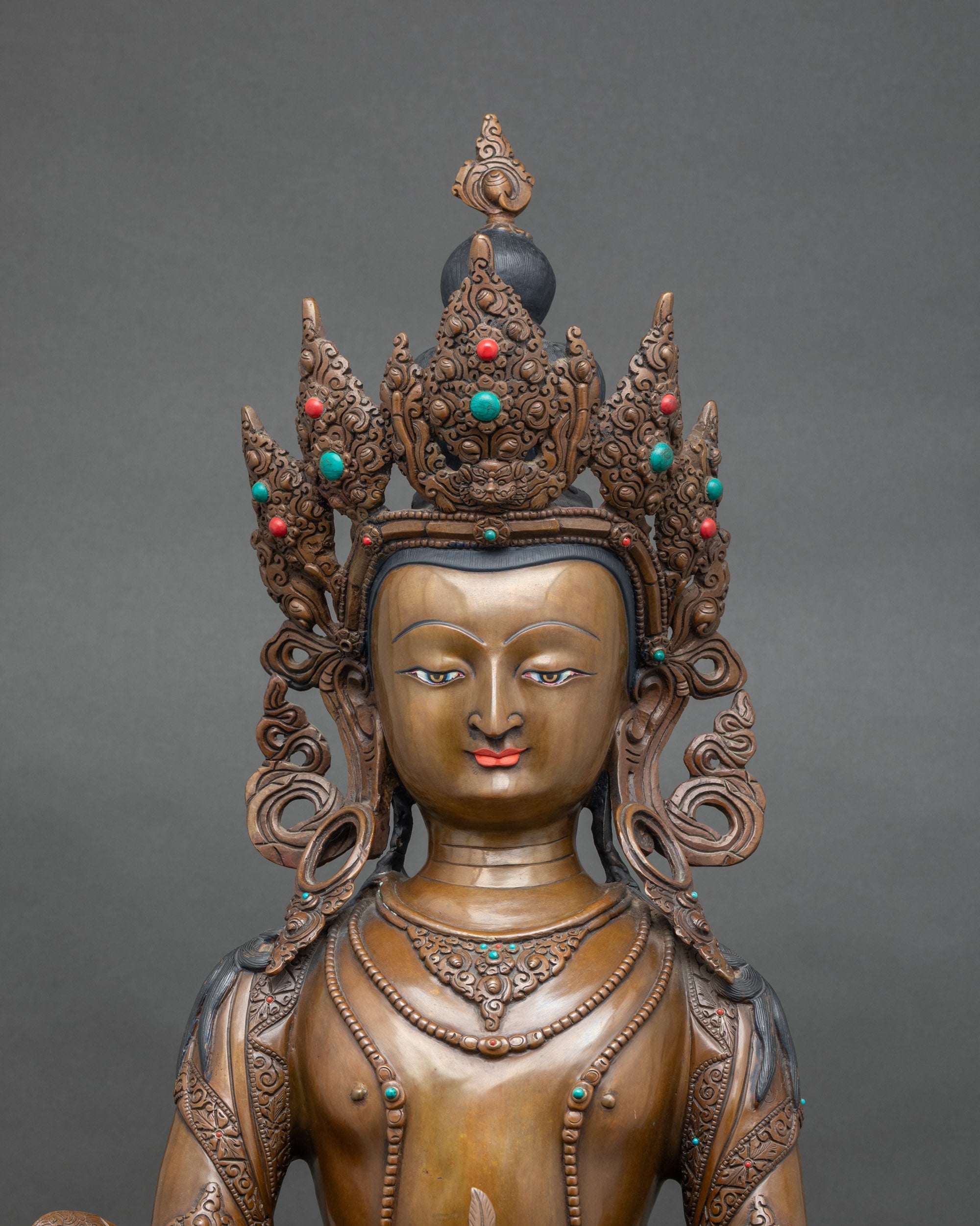 Close-up of Amitayus Altar Sculpture face, showing serene expression and detailed craftsmanship