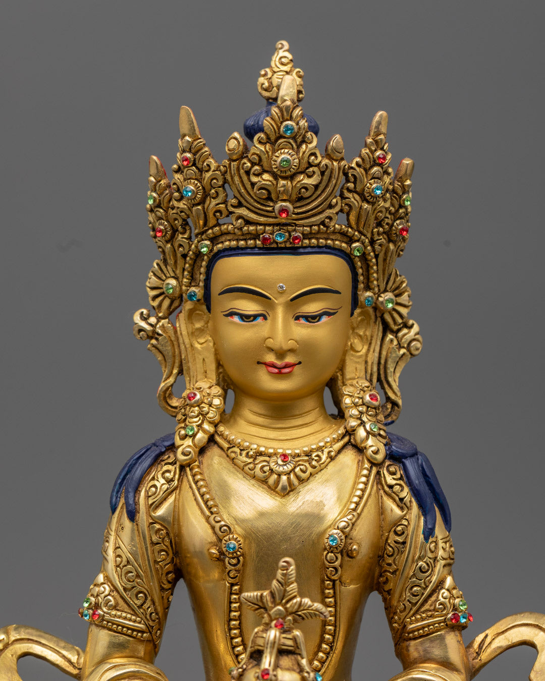 Amitayus Buddha Statue from Nepal, featuring intricate facial details, gold-plated finish, and semi-precious stone inlays, handcrafted using the lost wax method.