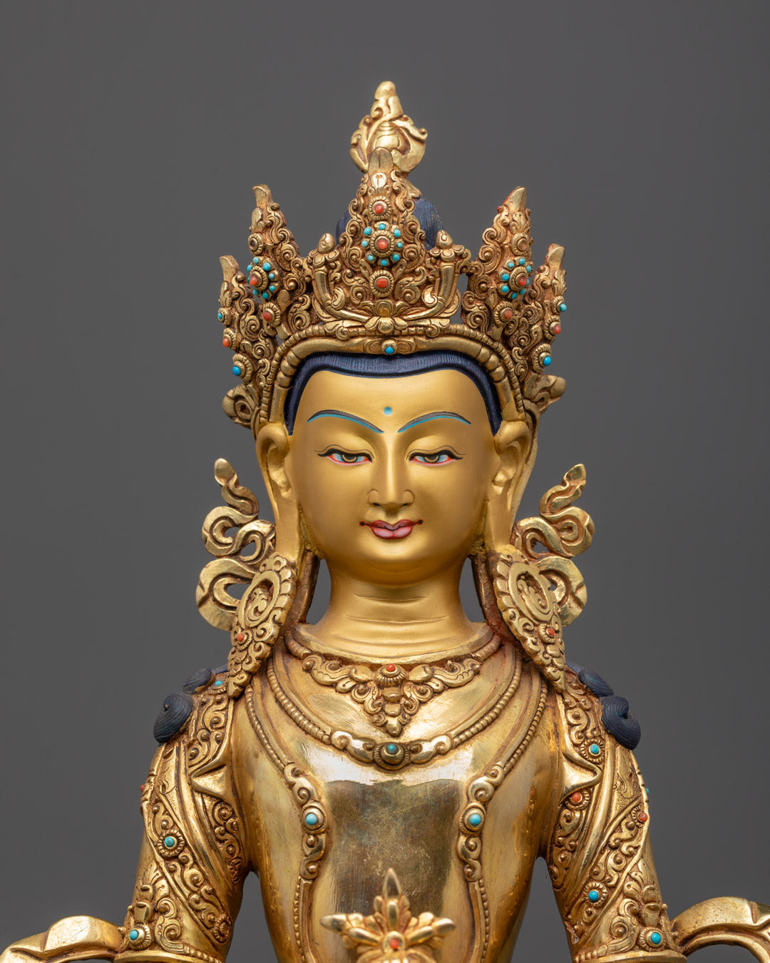 Amitayus Buddha face gilded in gold, showcasing intricate Himalayan artistry