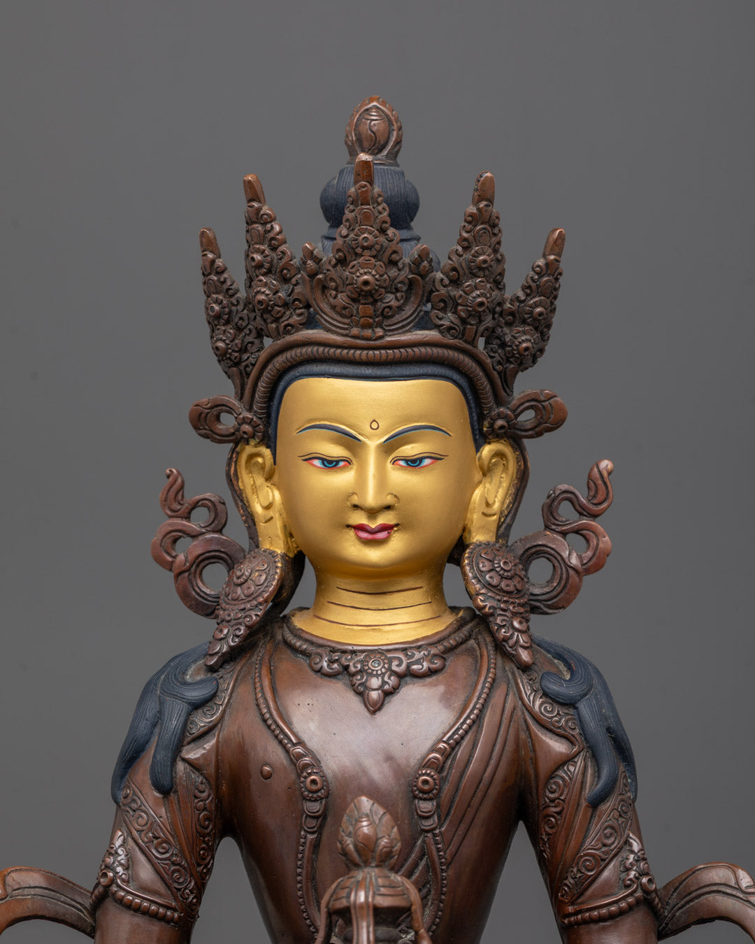 Close-up of Amitayus Buddha statue holding a vase of immortality