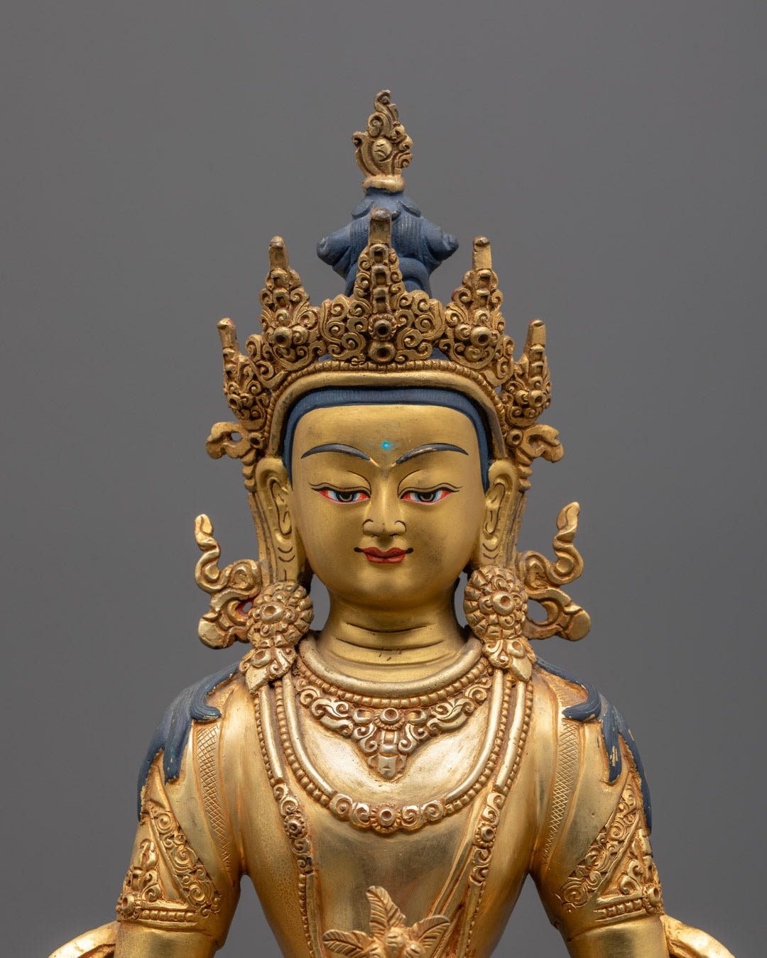 Close-up of Amitayus face with 24k fire-gilded gold and serene expression