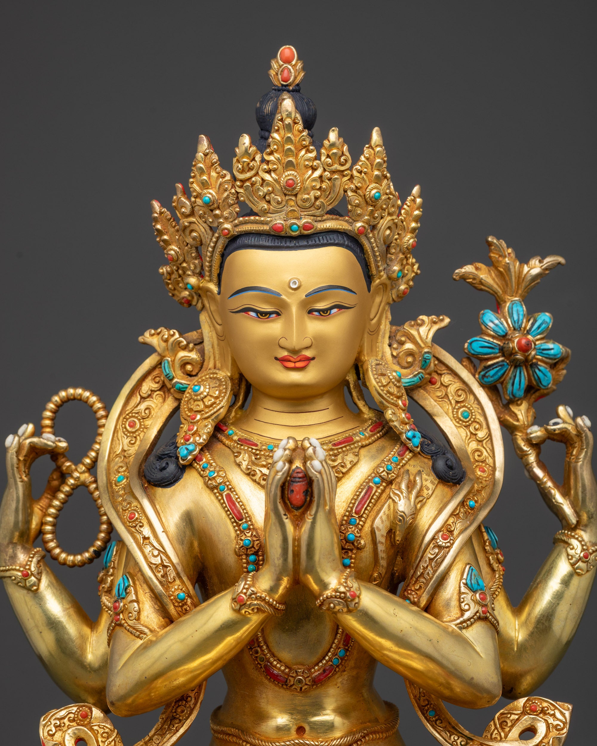 Close-up of Avalokiteshvara Chenrezig showing flowing robes, jeweled crown, and ornate jewelry