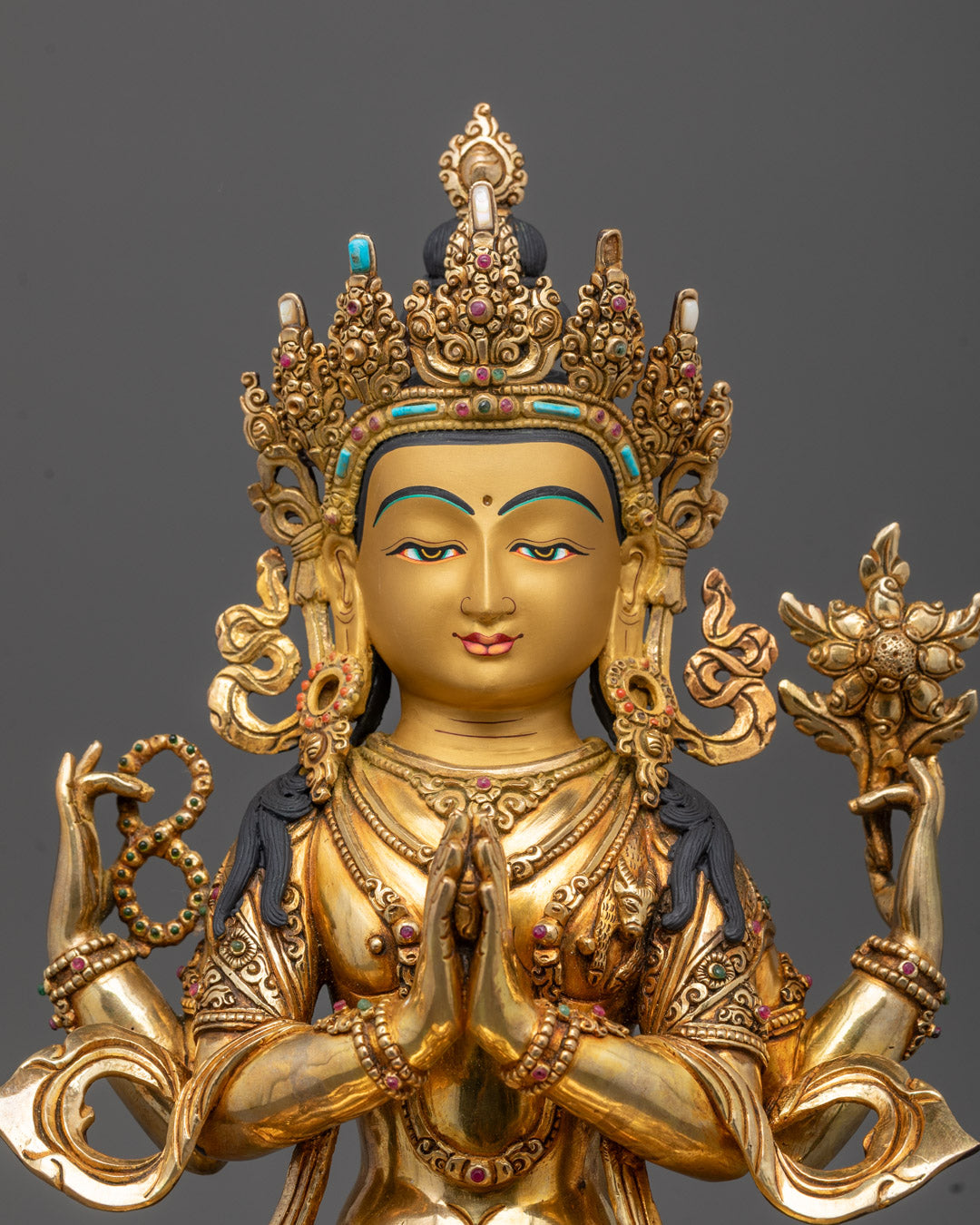 Close-up of Avalokiteshvara Sculpture showing intricate crown and semi-precious stones detail