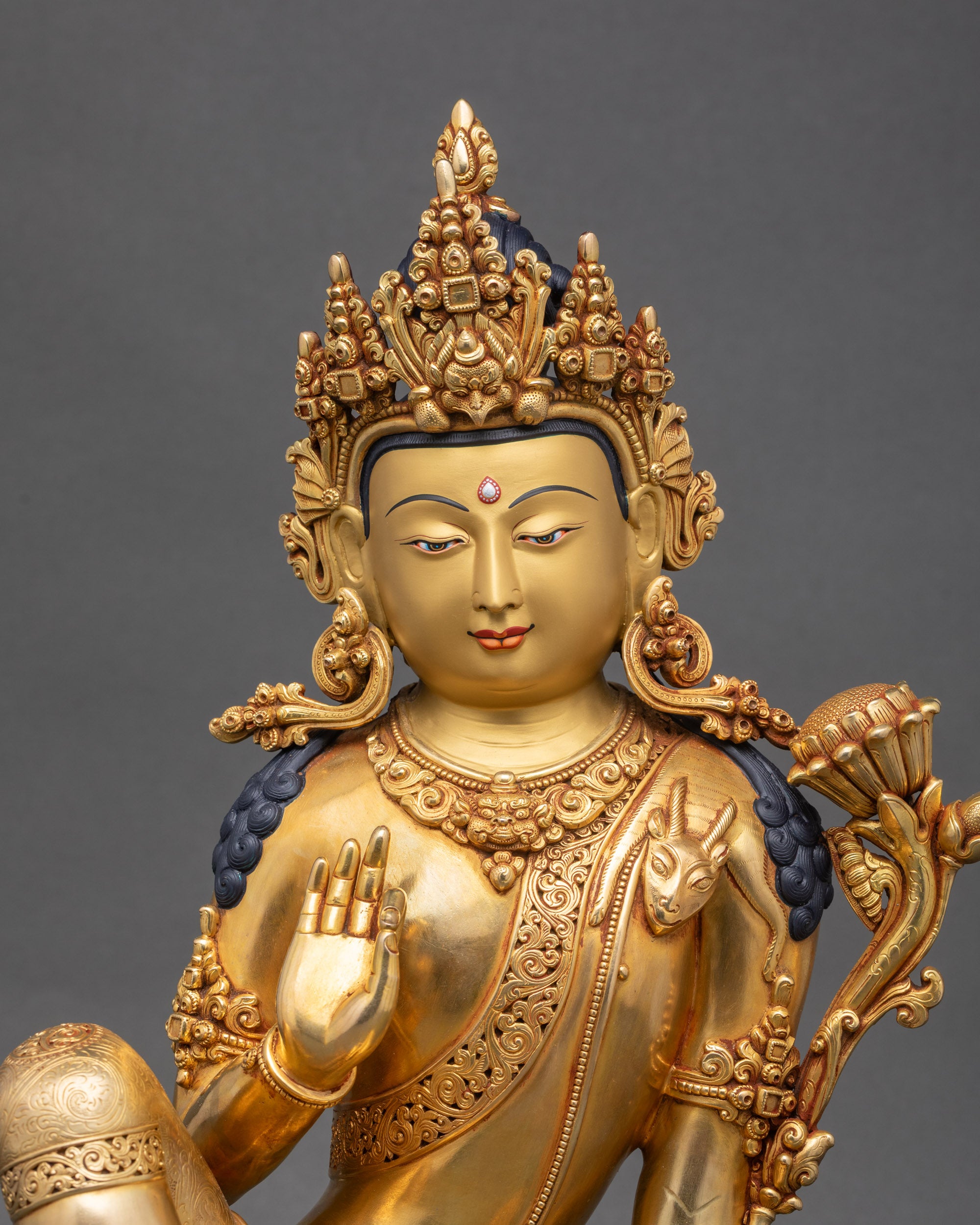 Close-up of Avalokiteshvara sculpture with triple gold fire-gilding details