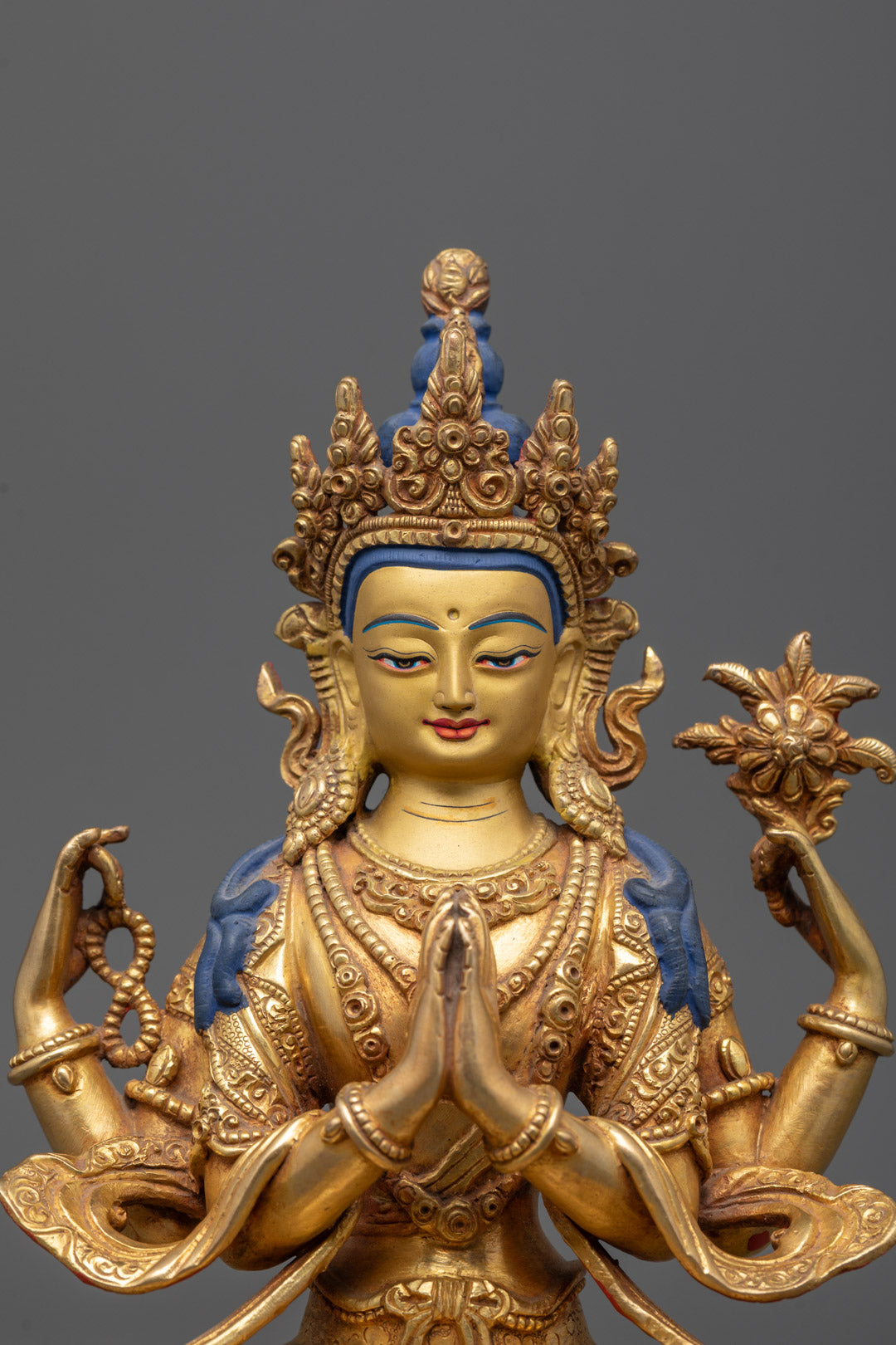 Close-up of Avalokiteshvara statue showcasing intricate details on the crown