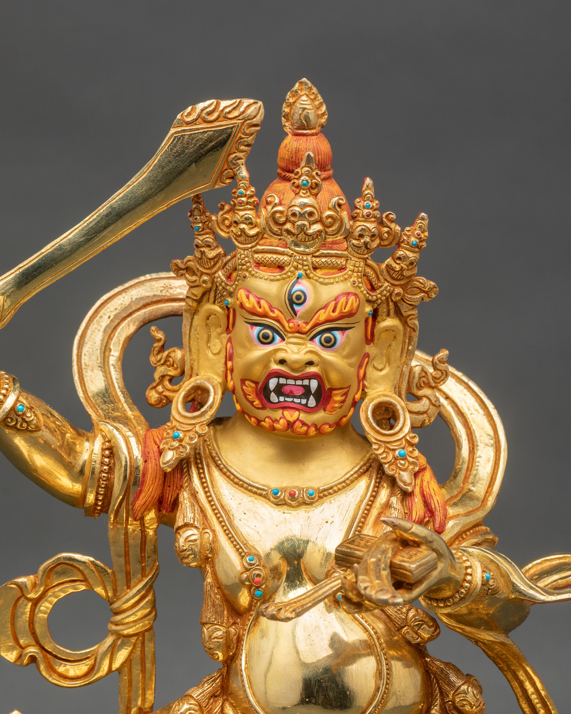 Close-up of Black Manjushri sculpture showing intricate wrathful copper and gold details
