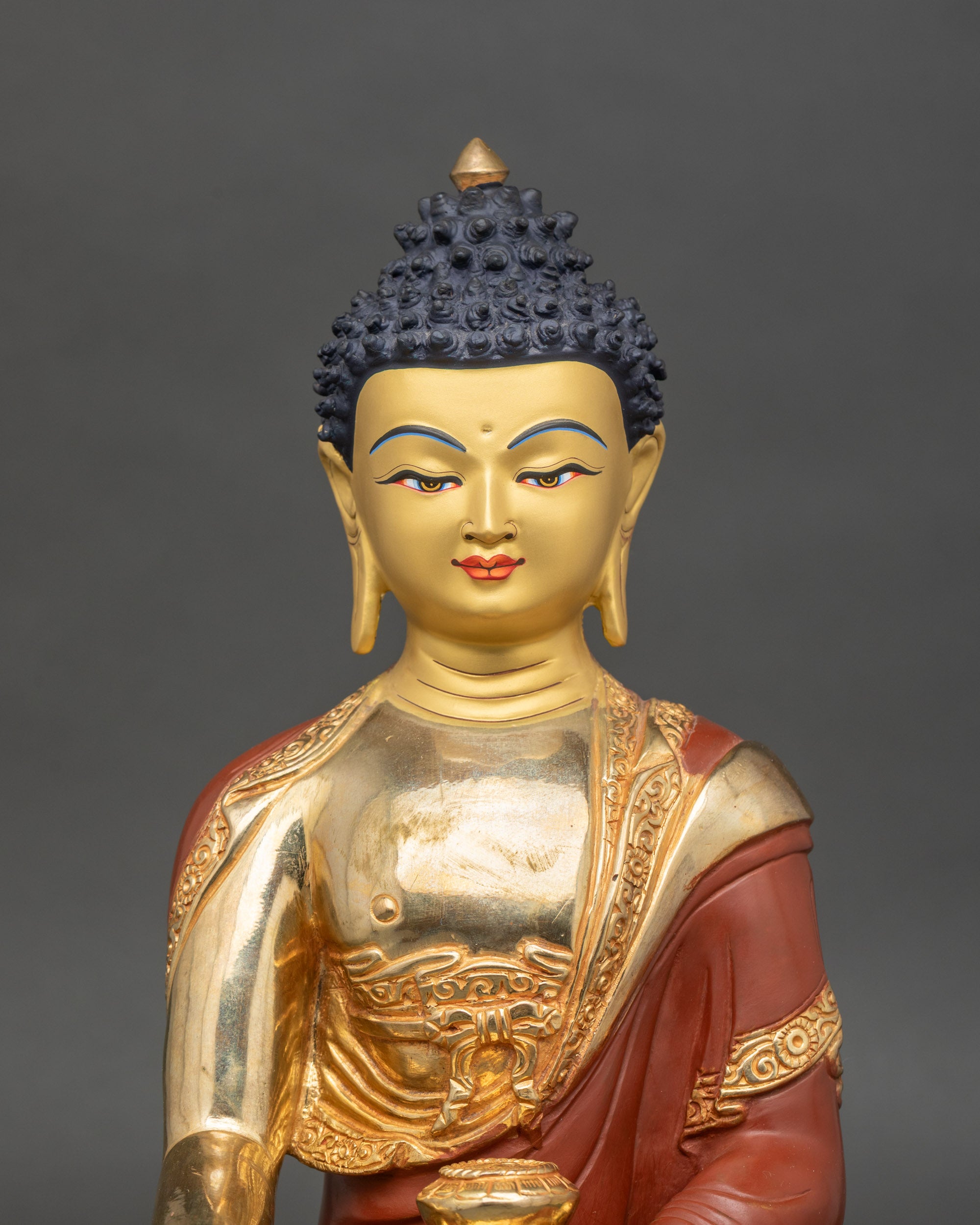 Close-up of Buddha Shakyamuni face showing tranquil expression and meditative posture