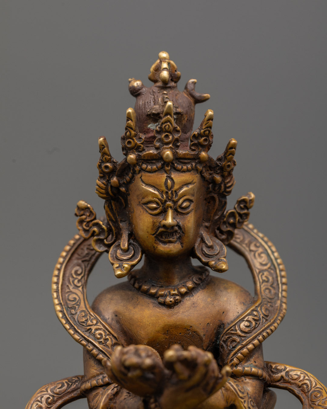Chakrasamvara’s fierce expression showing third eye of wisdom and tiger skin garment.