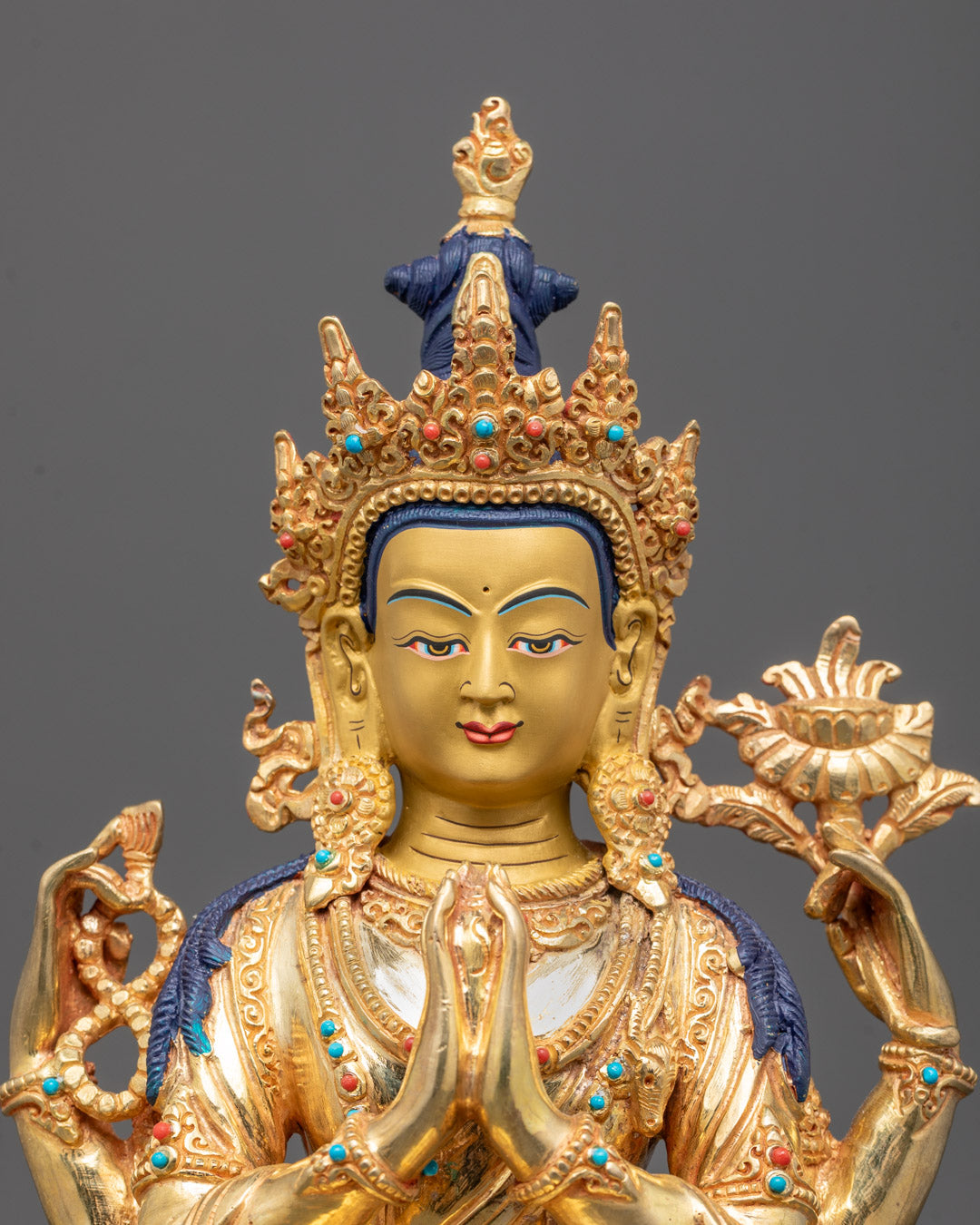 Close-up of Chenrezig Bodhisattva’s serene expression and detailed hand mudras