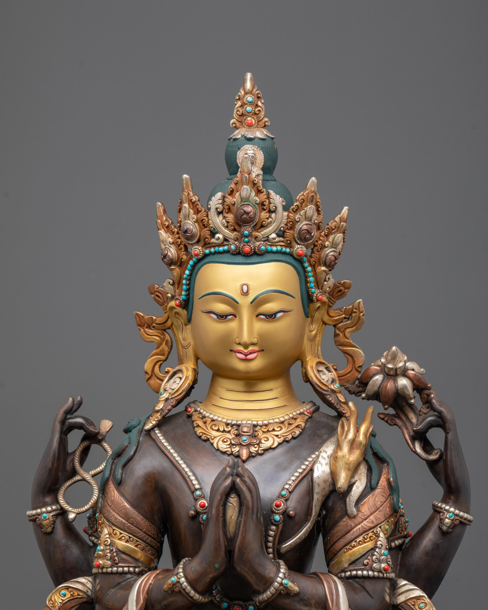 Close-up of Chenrezig’s crown, wish-fulfilling gem, and flowing robes with semi-precious stone details