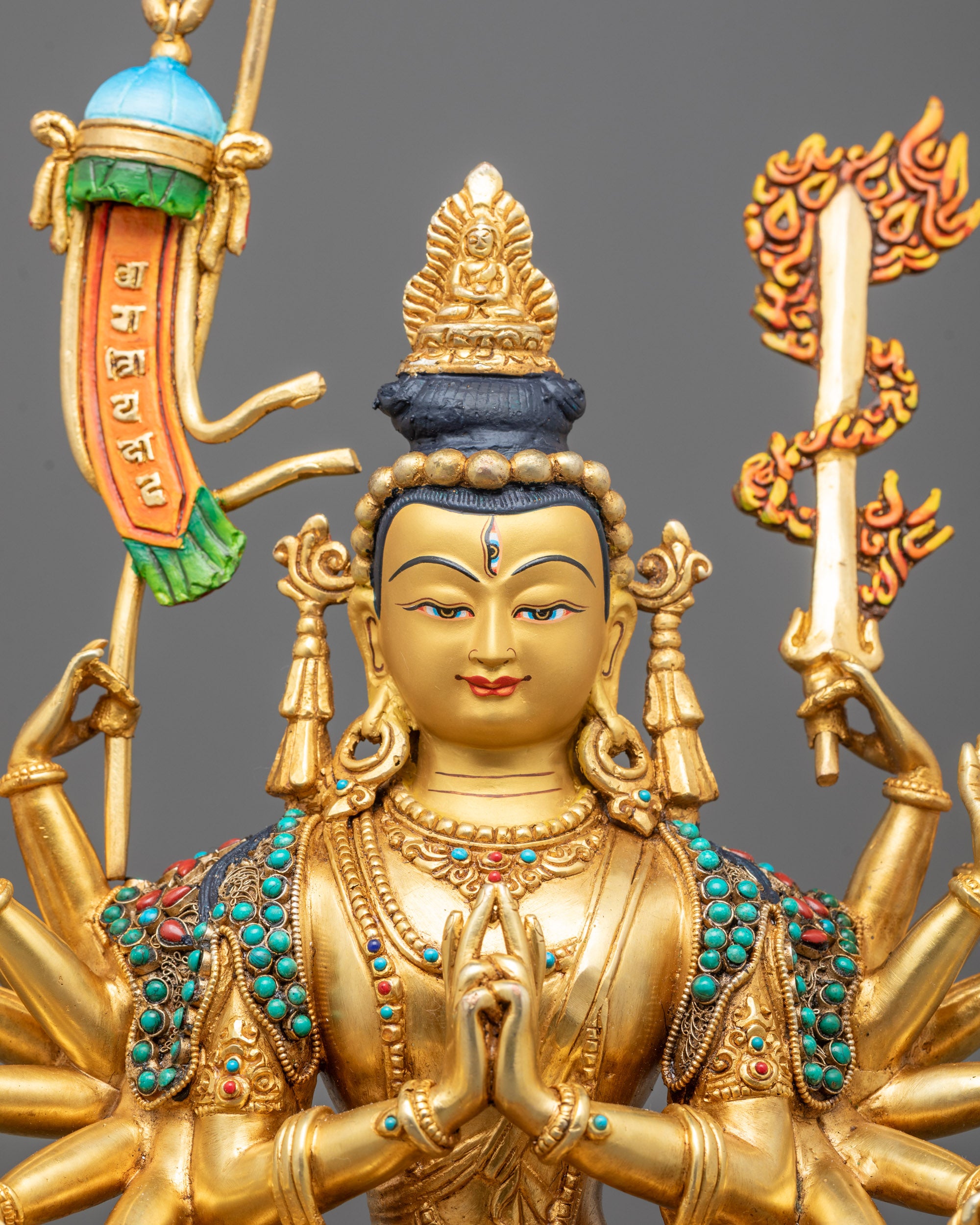 Close-up of Chundi Devi's serene face and ornate crown, featuring delicate gold