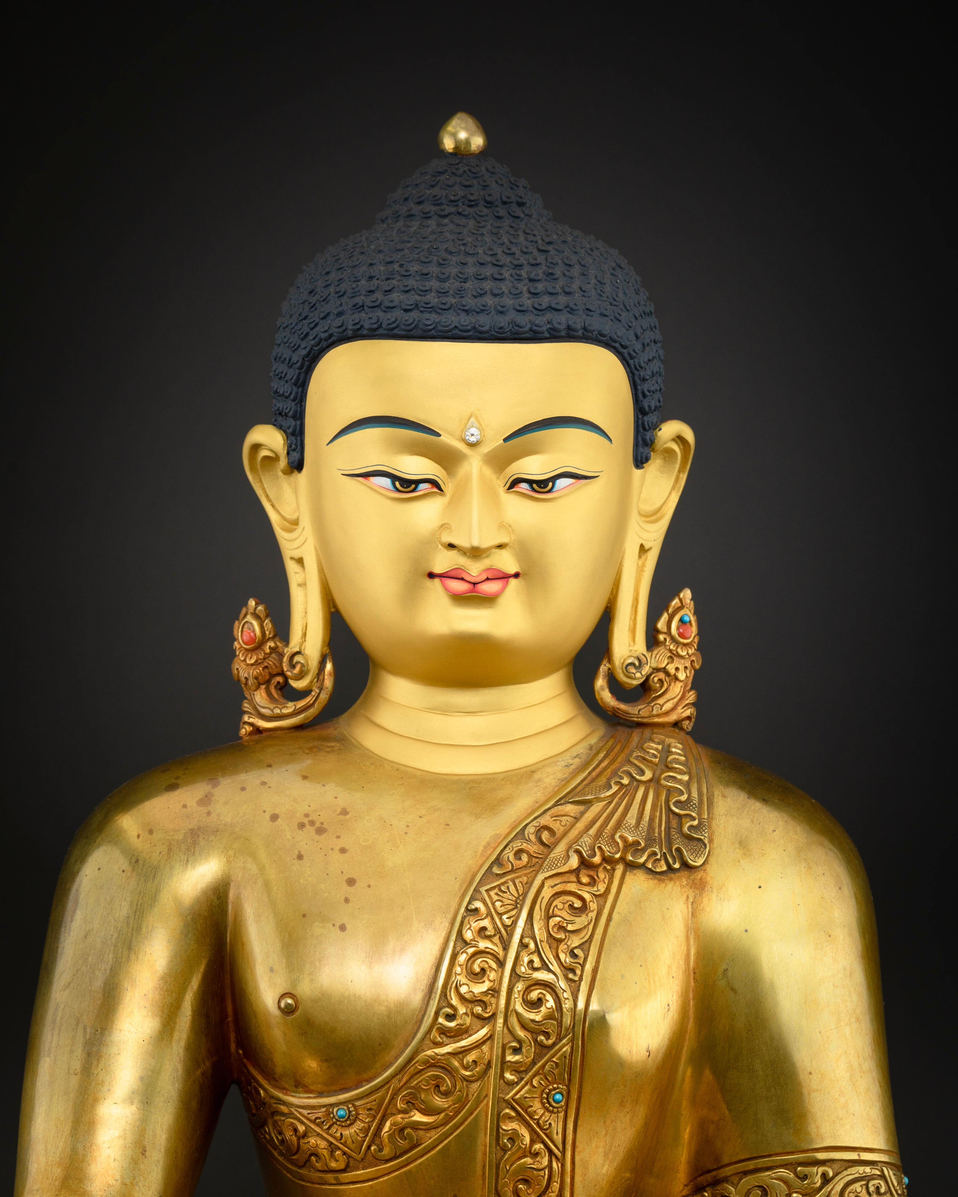 Close-up of Exquisite 24K Gold-Plated Face of Shakyamuni Buddha