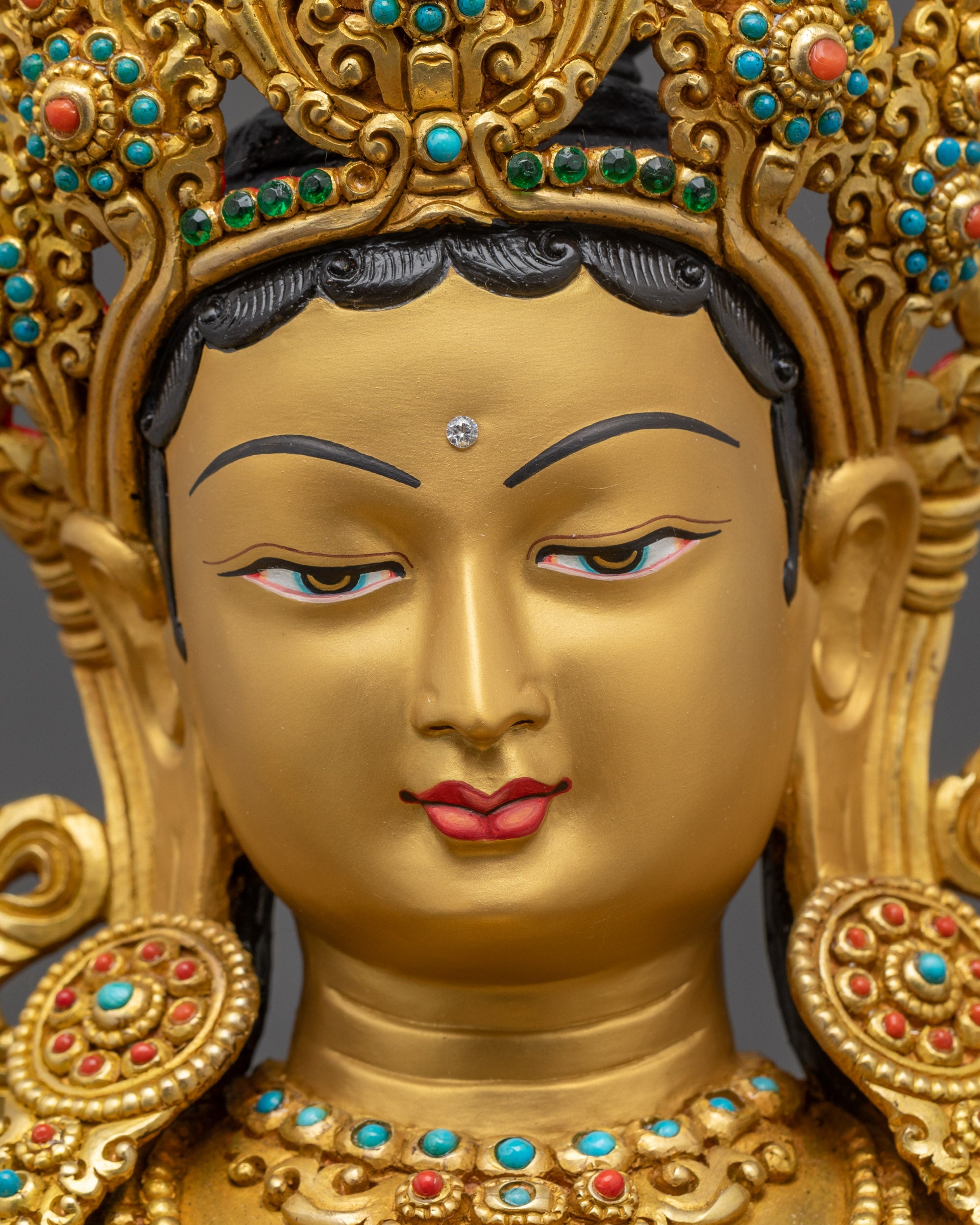 Close-up of Green Tara Gold Fire-Gilded Face and Intricate Lotus Base Details