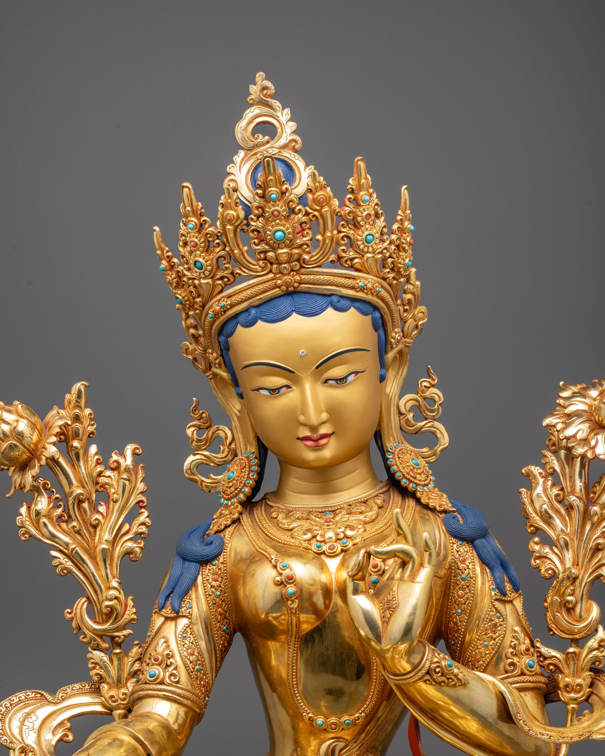 Close-up of Green Tara’s serene face and detailed crown showing traditional Nepalese
