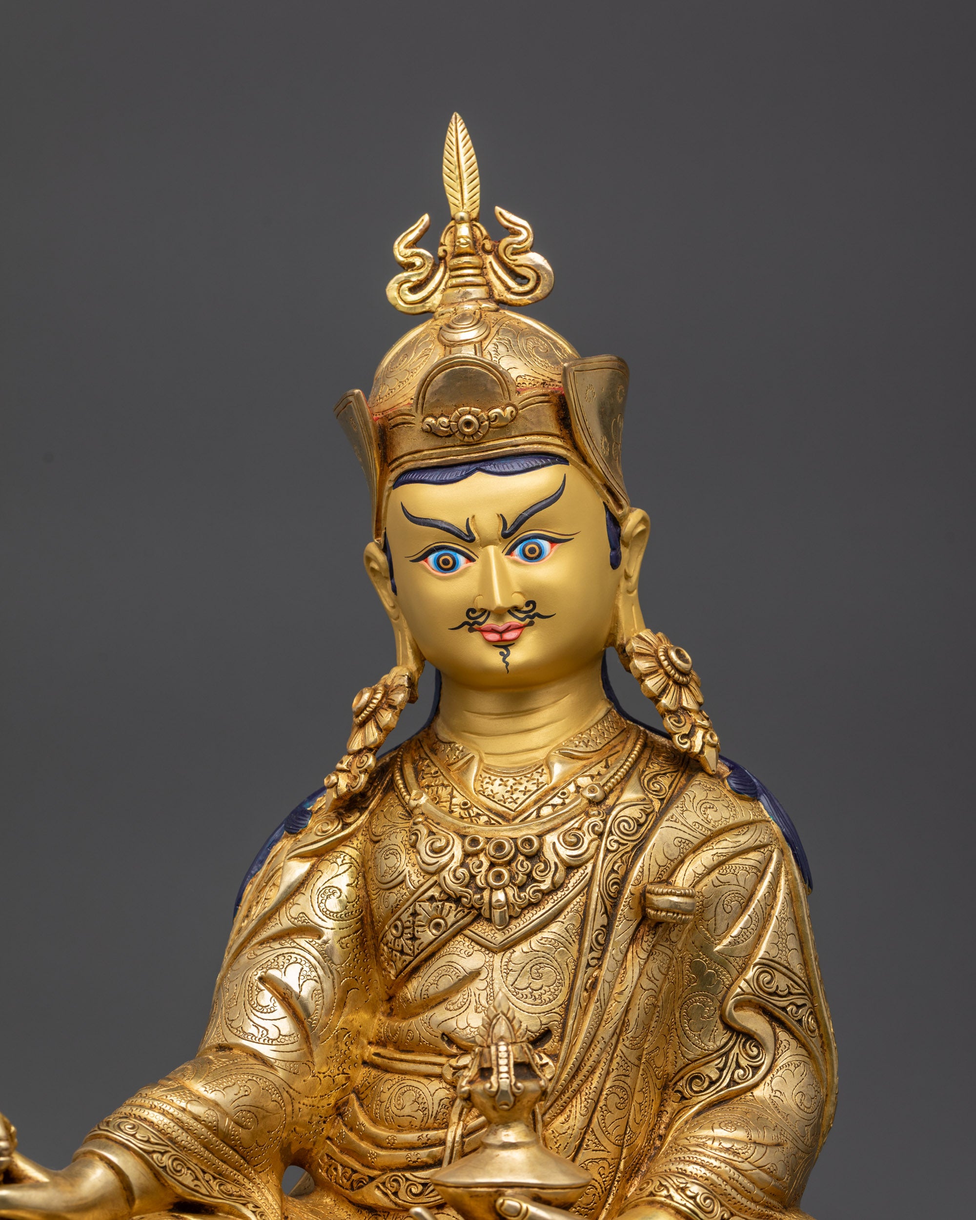 Close-up of Guru Rinpoche face with wrathful yet compassionate expression