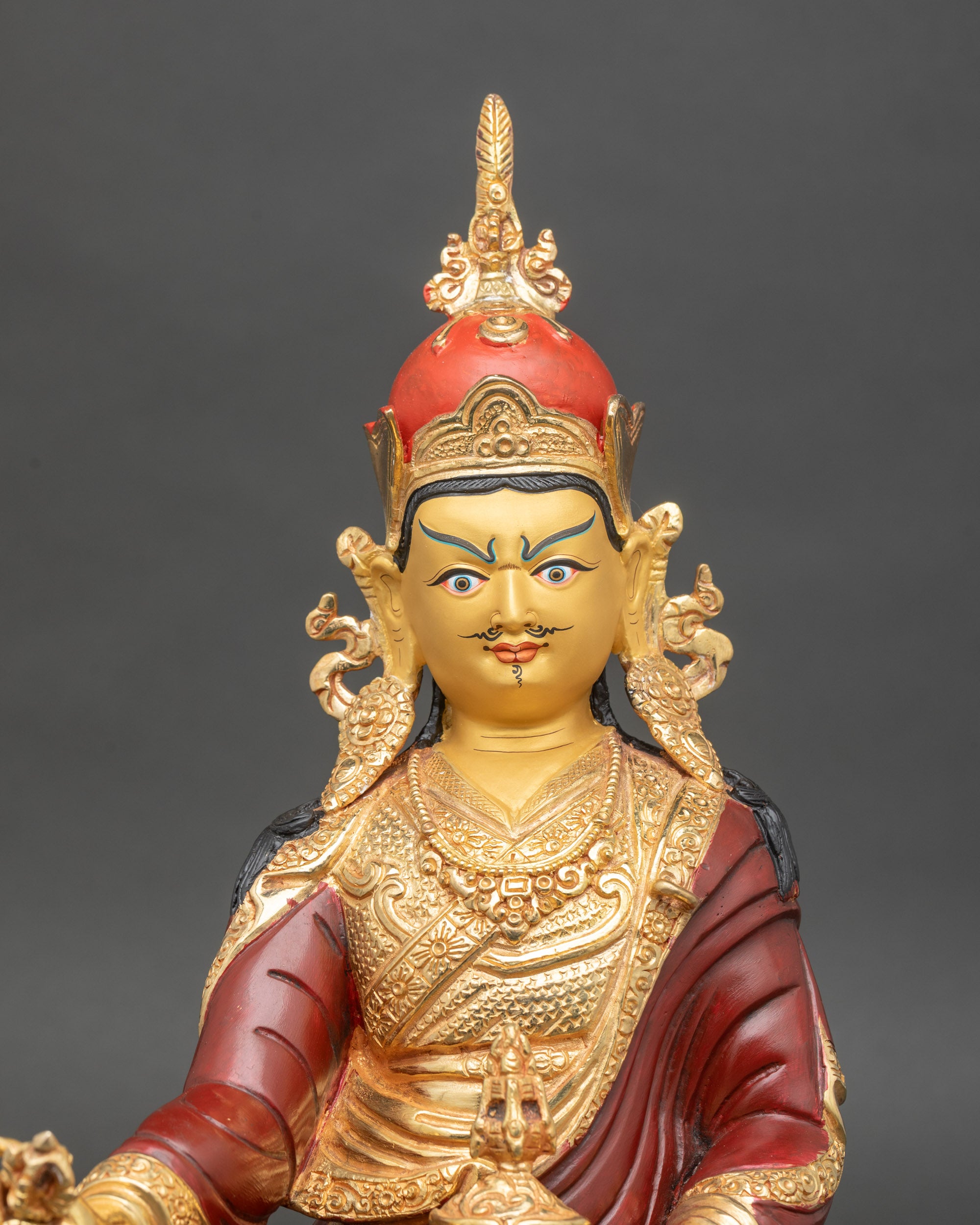 Close-up of Guru Rinpoche holding Vajra and Kapala, detailed acrylic colors and gold fire gilding