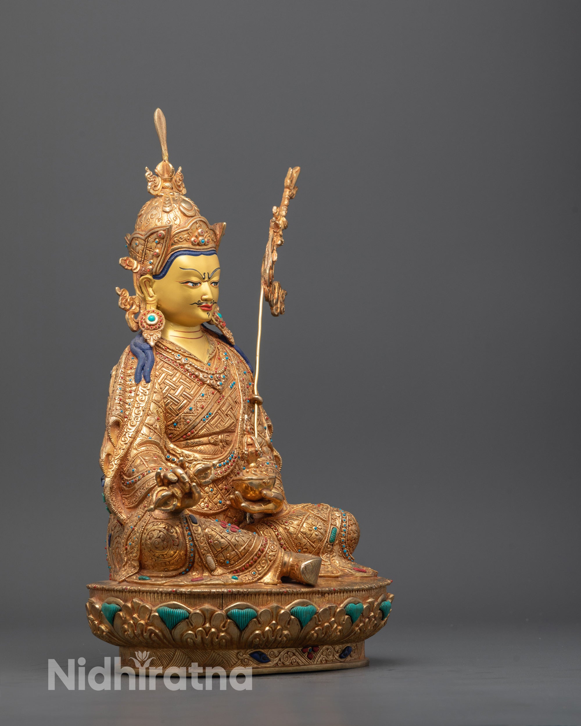 Close-up of Guru Rinpoche’s face highlighting the semi-wrathful expression