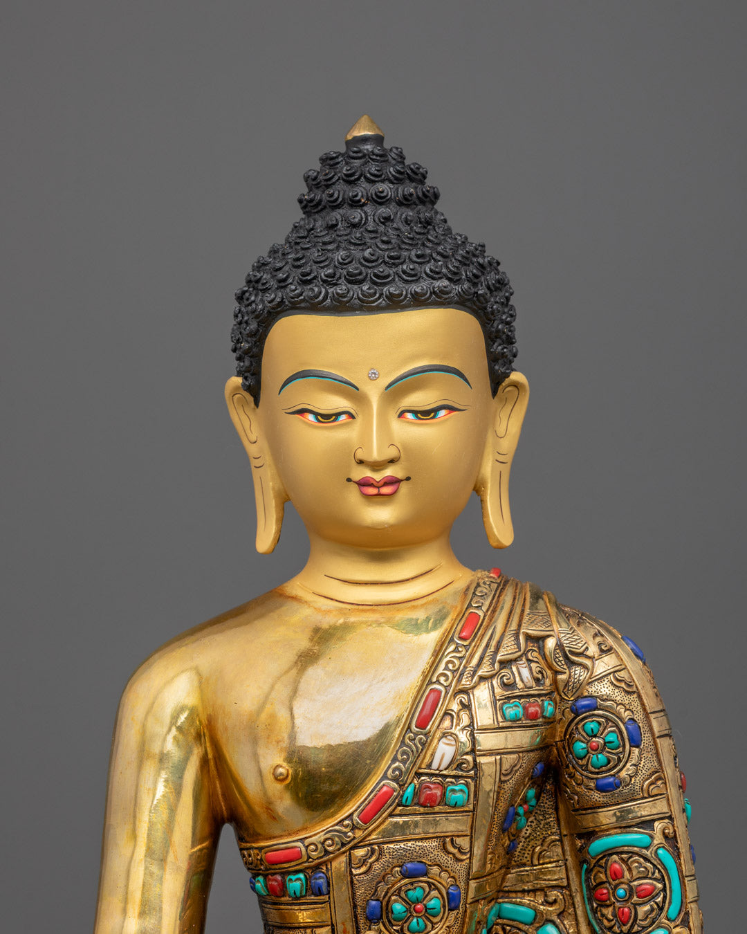Close-up of Healing Buddha Bhaisajyaguru crown and detailed carvings with turquoise stones
