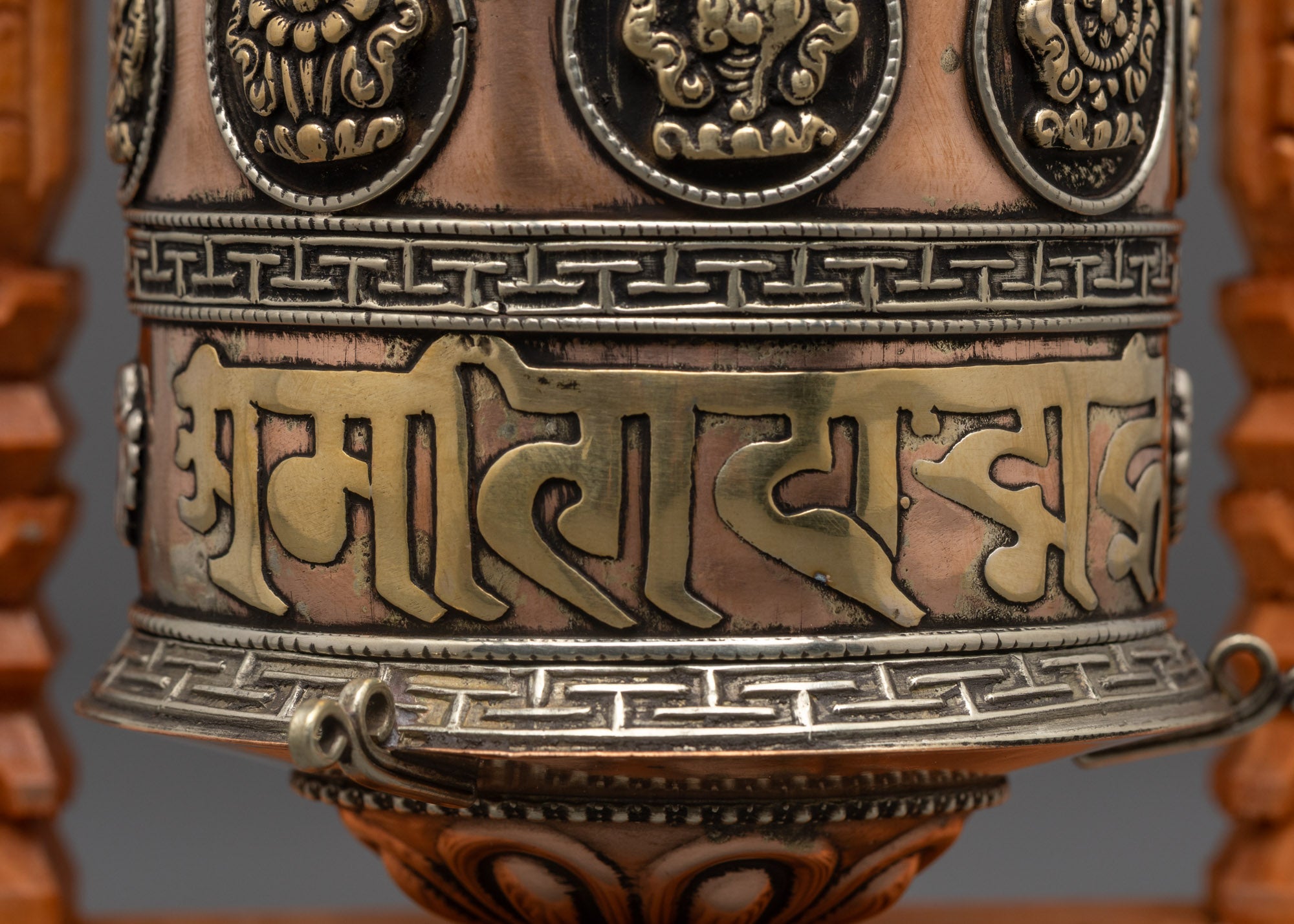 Close-up of Himalayan copper and brass Mantra Prayer Wheel for shrine and temple use