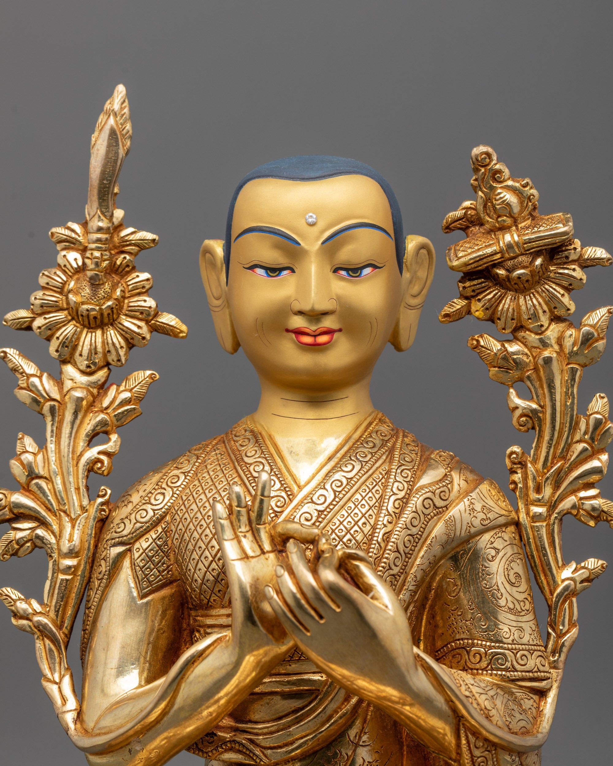 Close-up of Je Tsongkhapa’s serene face and ornate crown with intricate craftsmanship