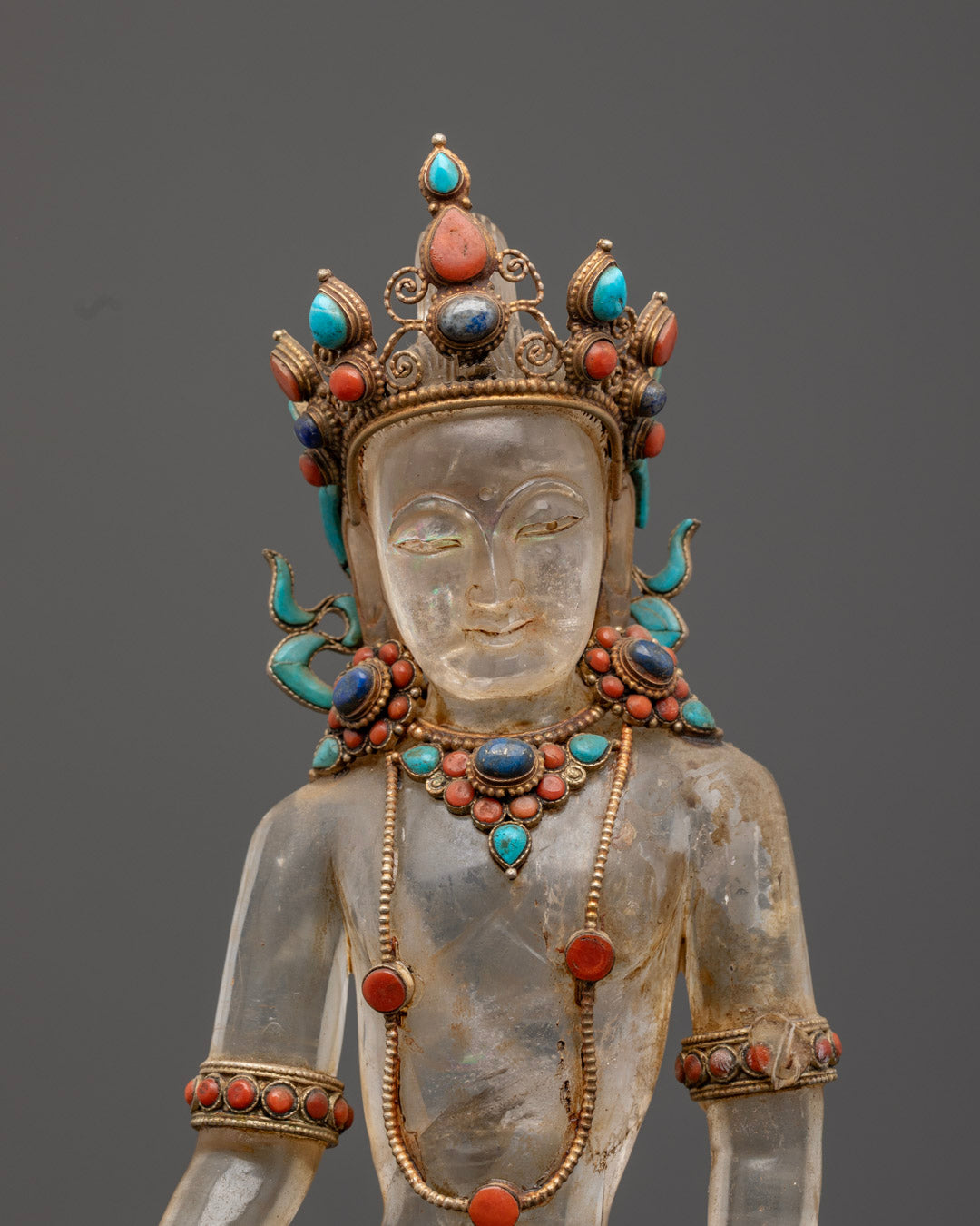 Lokeshwor Bodhisattva’s face, showcasing intricate craftsmanship, 24k gold gilding, and detailed jewel inlays.