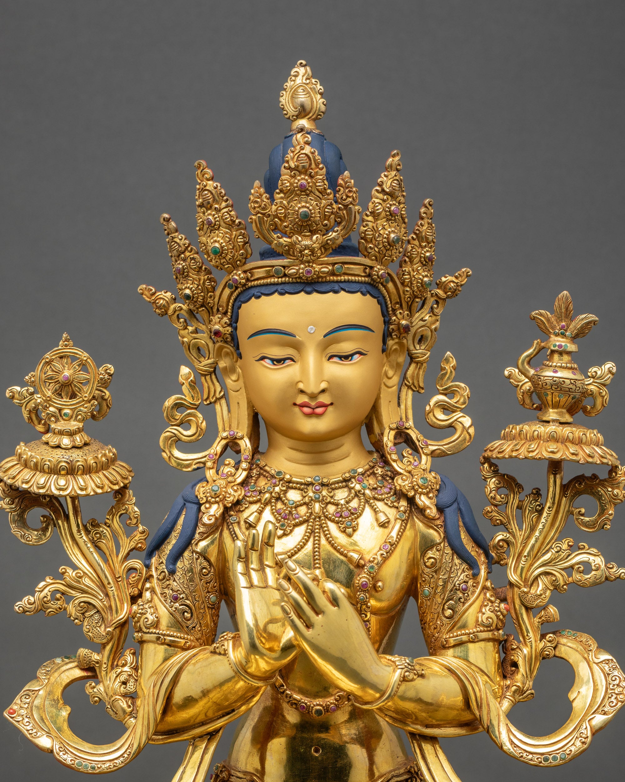 Close-up of Maitreya Buddha Statue showing Five-Jeweled Crown and Dharmachakra Mudra hand gesture