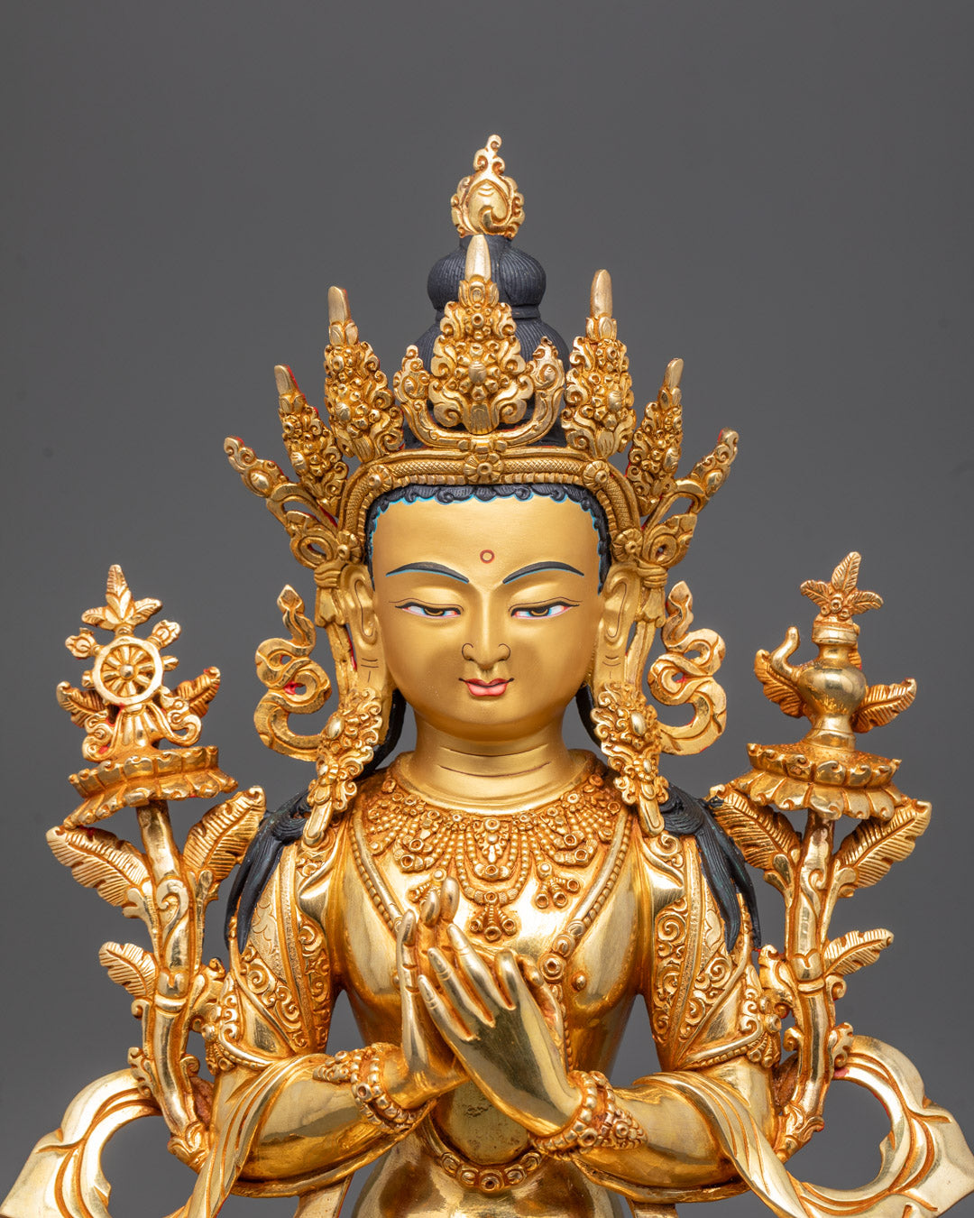 Close-up of Maitreya Buddha’s crown, jewelry, and intricately carved grand halo