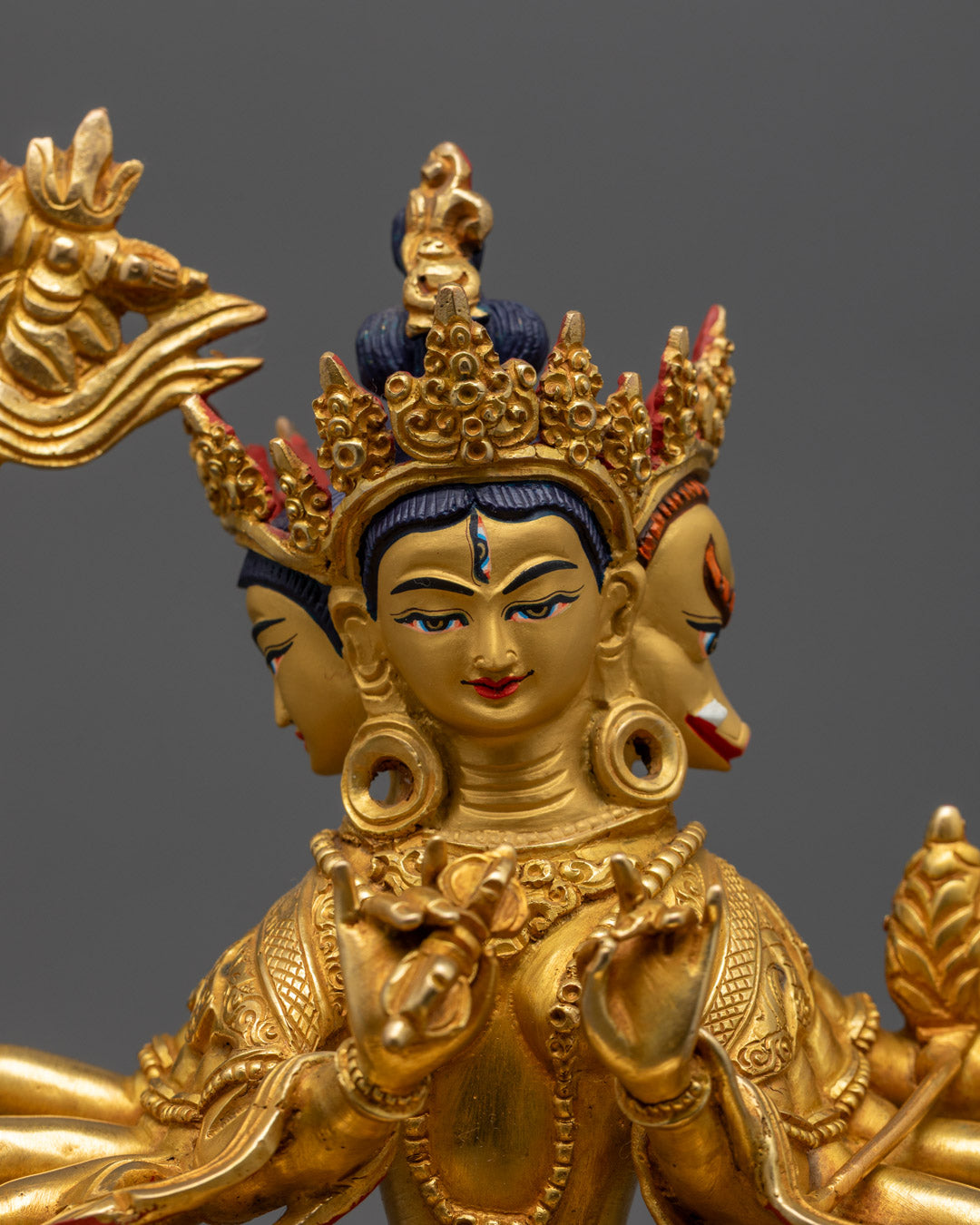 Marichi’s serene face and symbolic attributes, including protective mudras and radiant crown