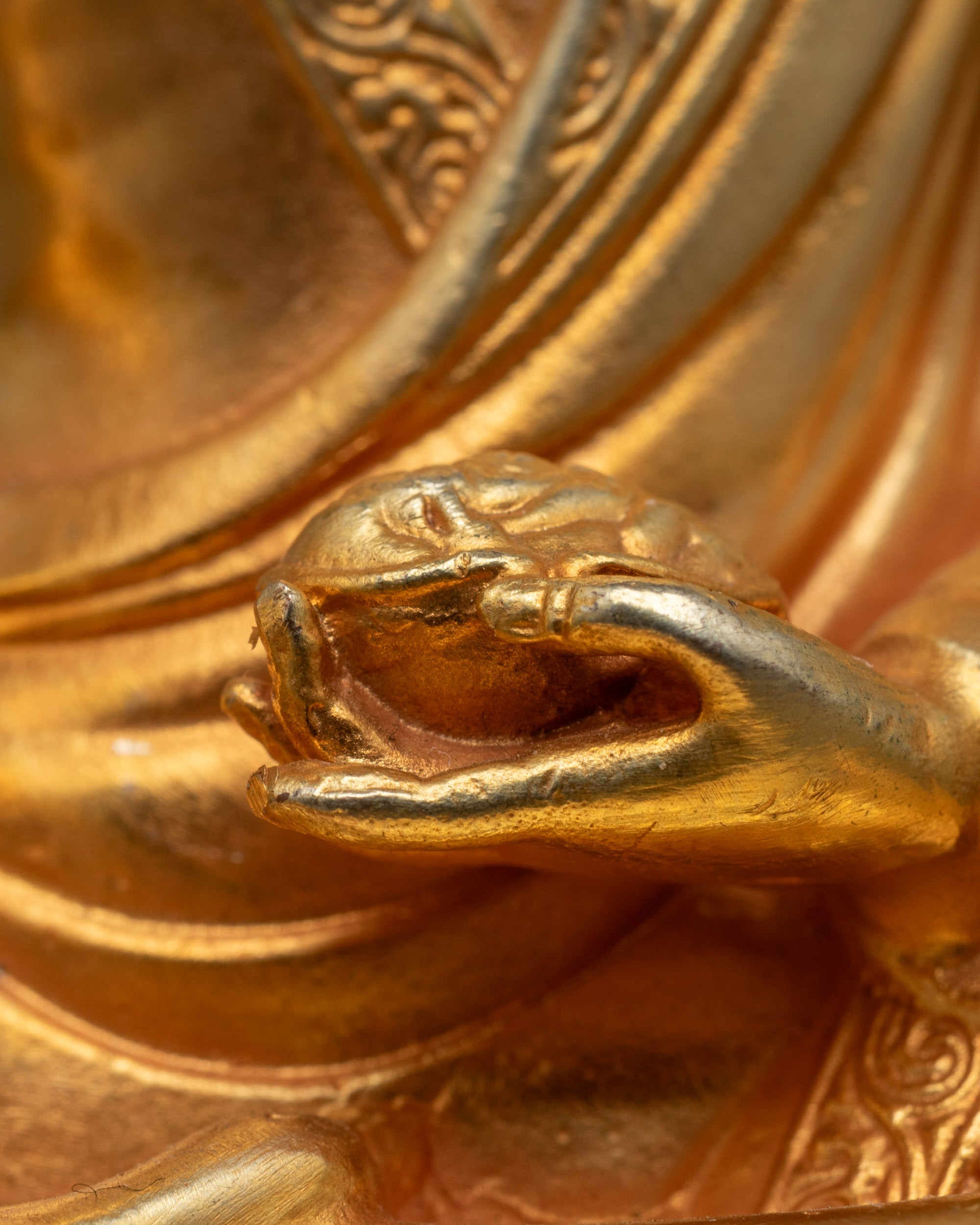 Close-up of Marpha Set statue faces showcasing intricate electroplated gold finish