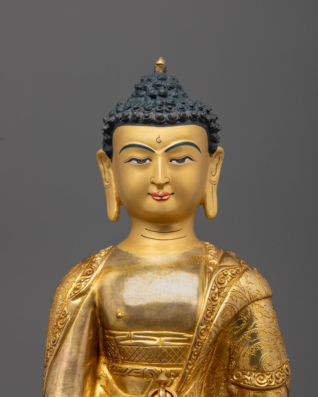 Close-up of Mitrugpa Buddha’s wrathful face and detailed