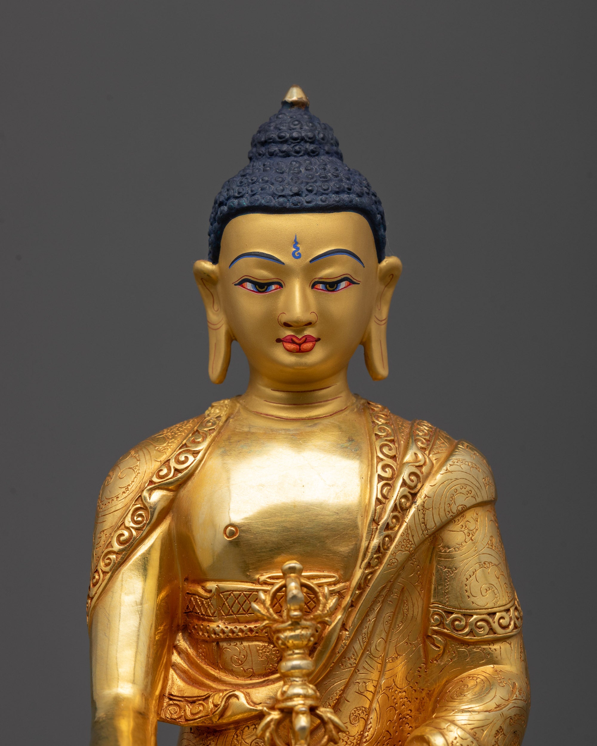 Close-up of Mitrugpa Statue’s intricate carvings and gold detailing