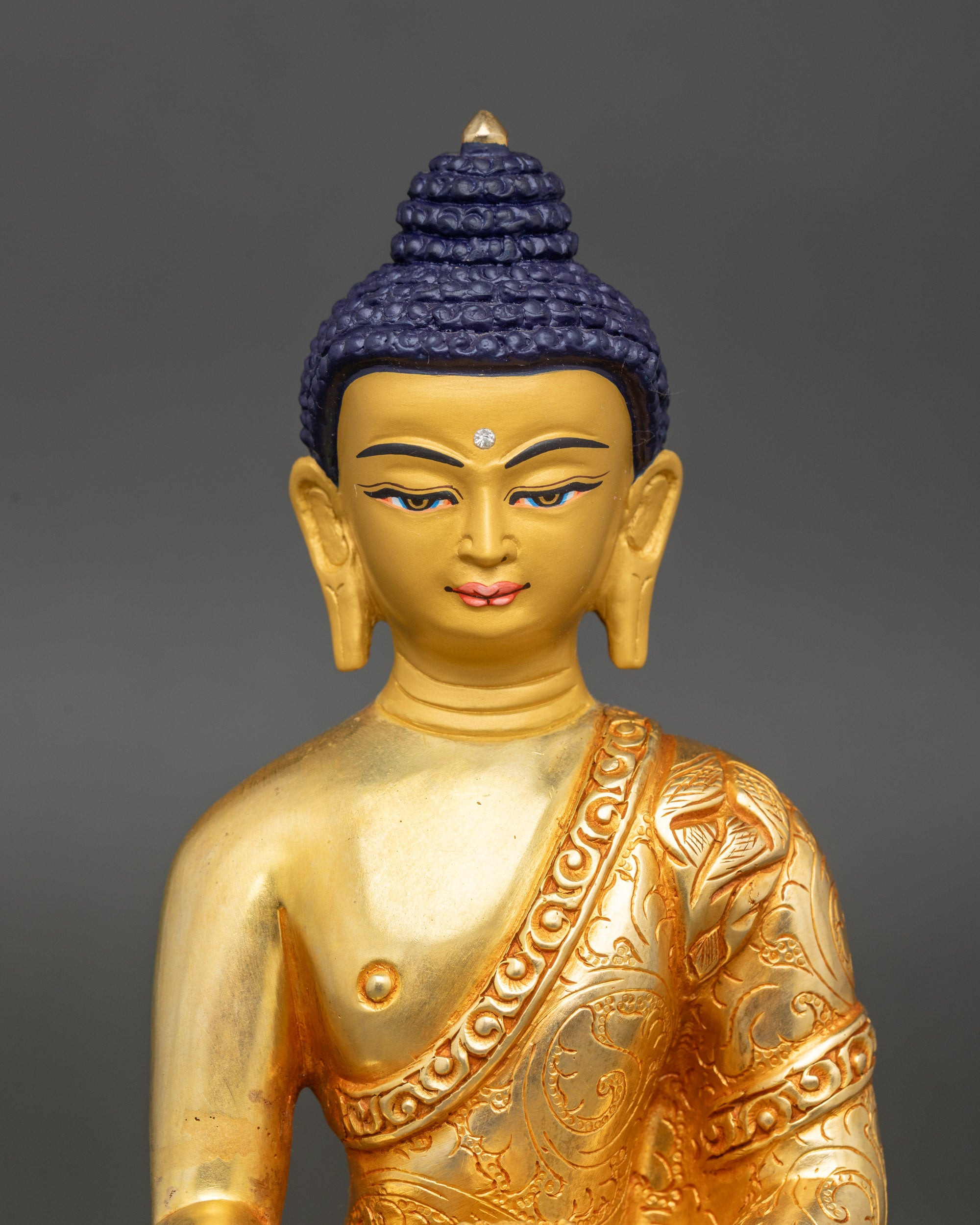 Close-up of Shakyamuni Buddha face, gold-painted, serene expression, meditation art