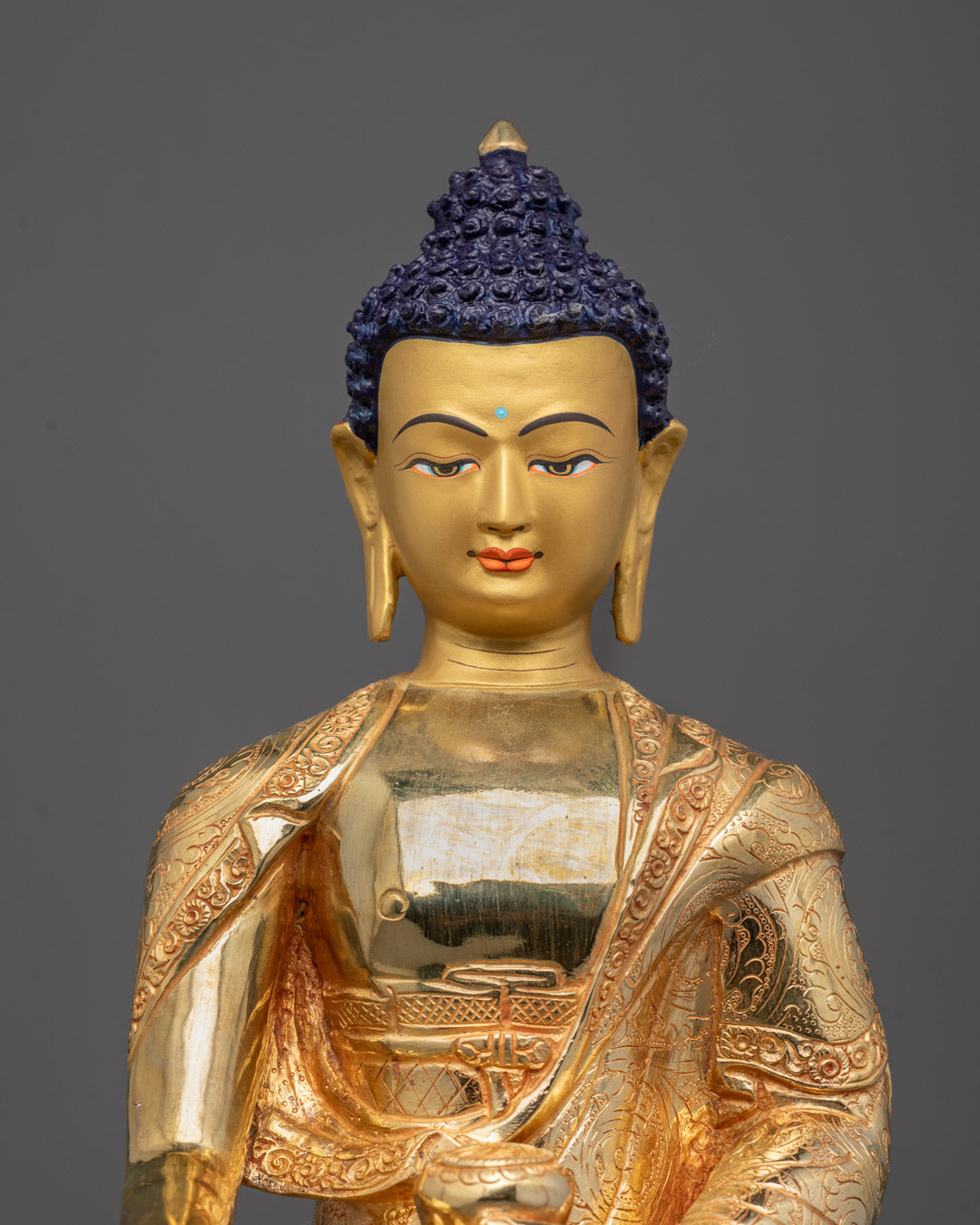 Close-up of Shakyamuni Buddha’s serene face hand-crafted by Nepalese artisan