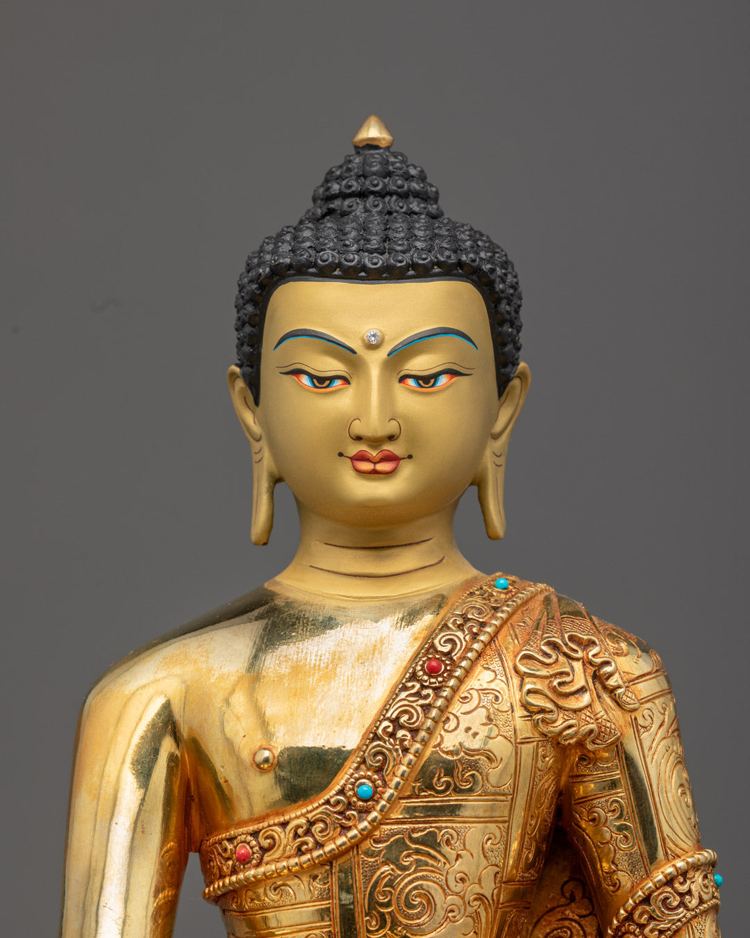 Siddhartha Gautama Buddha’s golden face with downcast eyes, symbolizing wisdom, peace, and spiritual awakening.