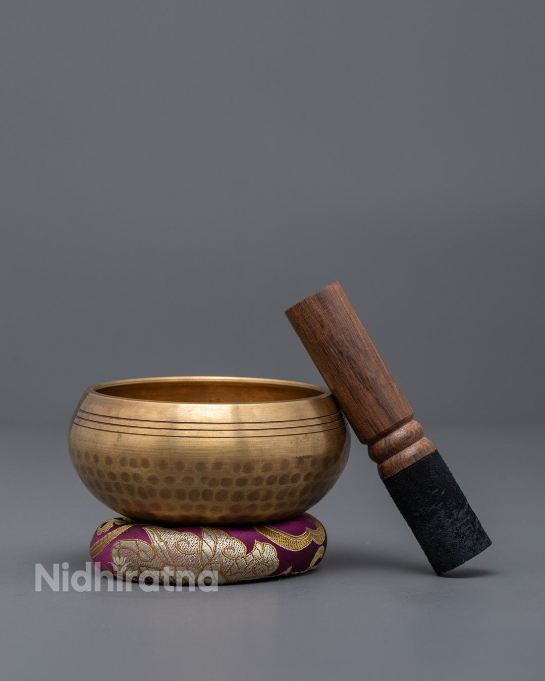 Close-up of Singing Bowl Rim and Mallet