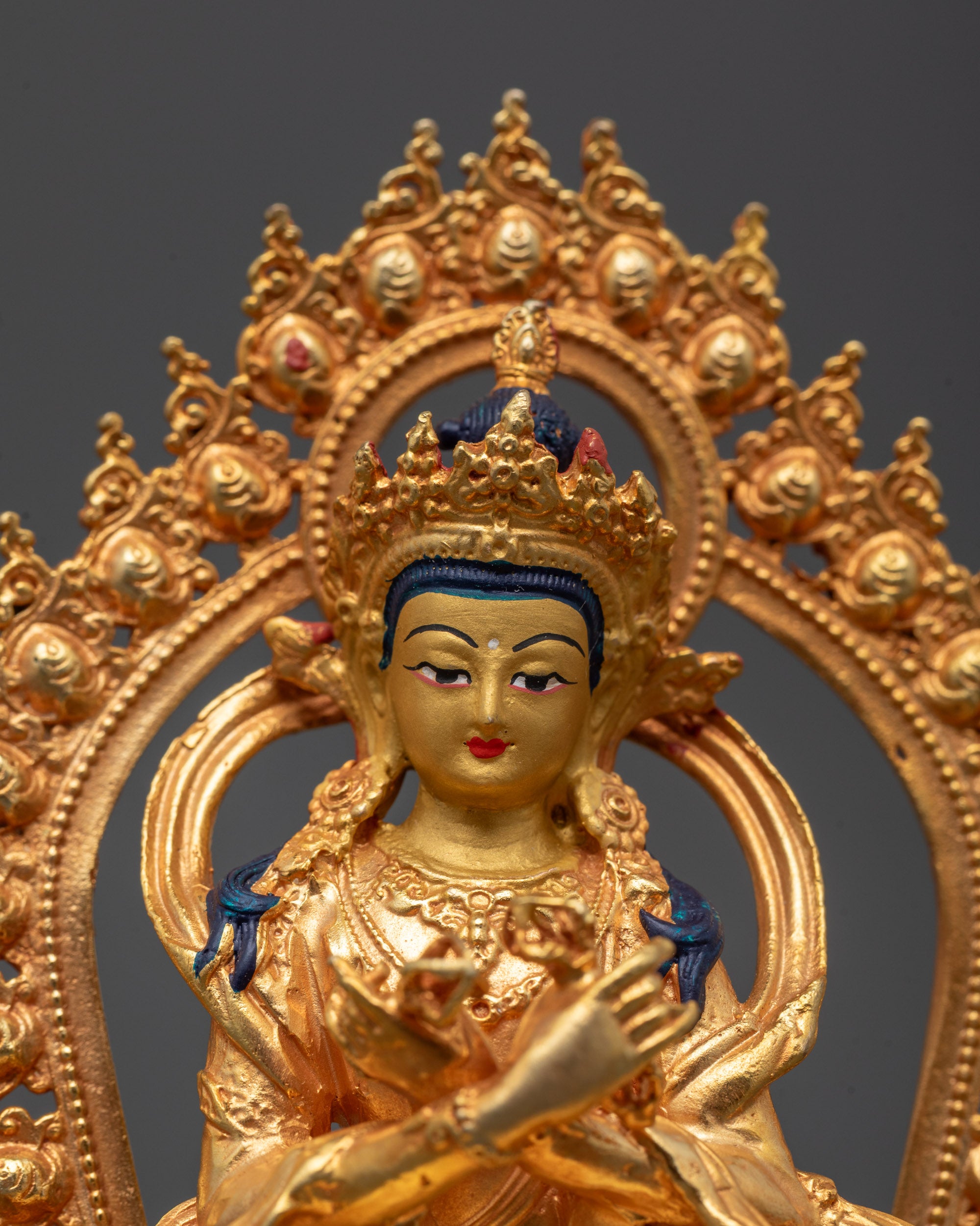 Close-up of Vajradhara Statue holding vajras in both hands, crafted with 24k gold finish