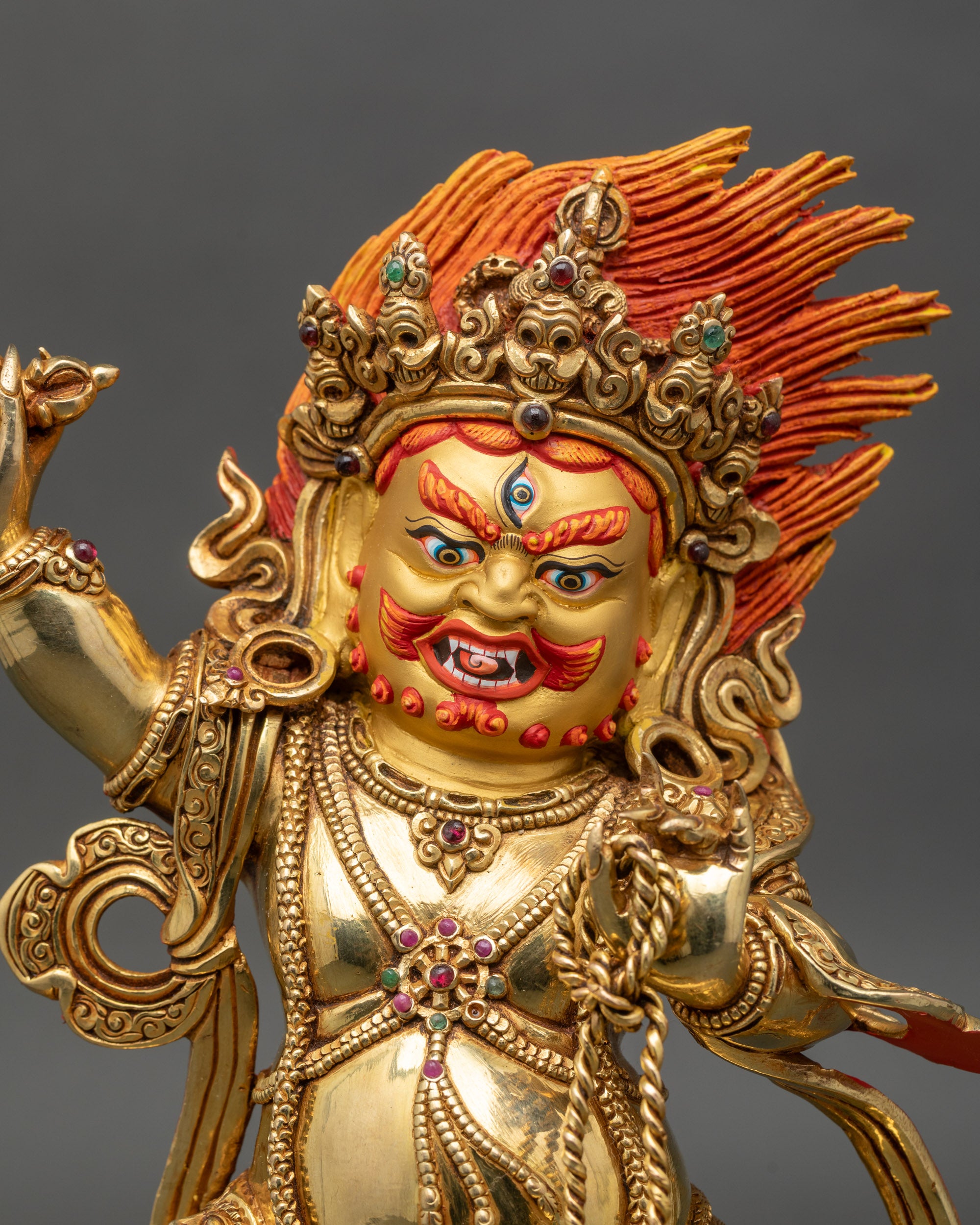 Close-up of Vajrapani Bodhisattva statue, detailed copper and gold fire-gilding