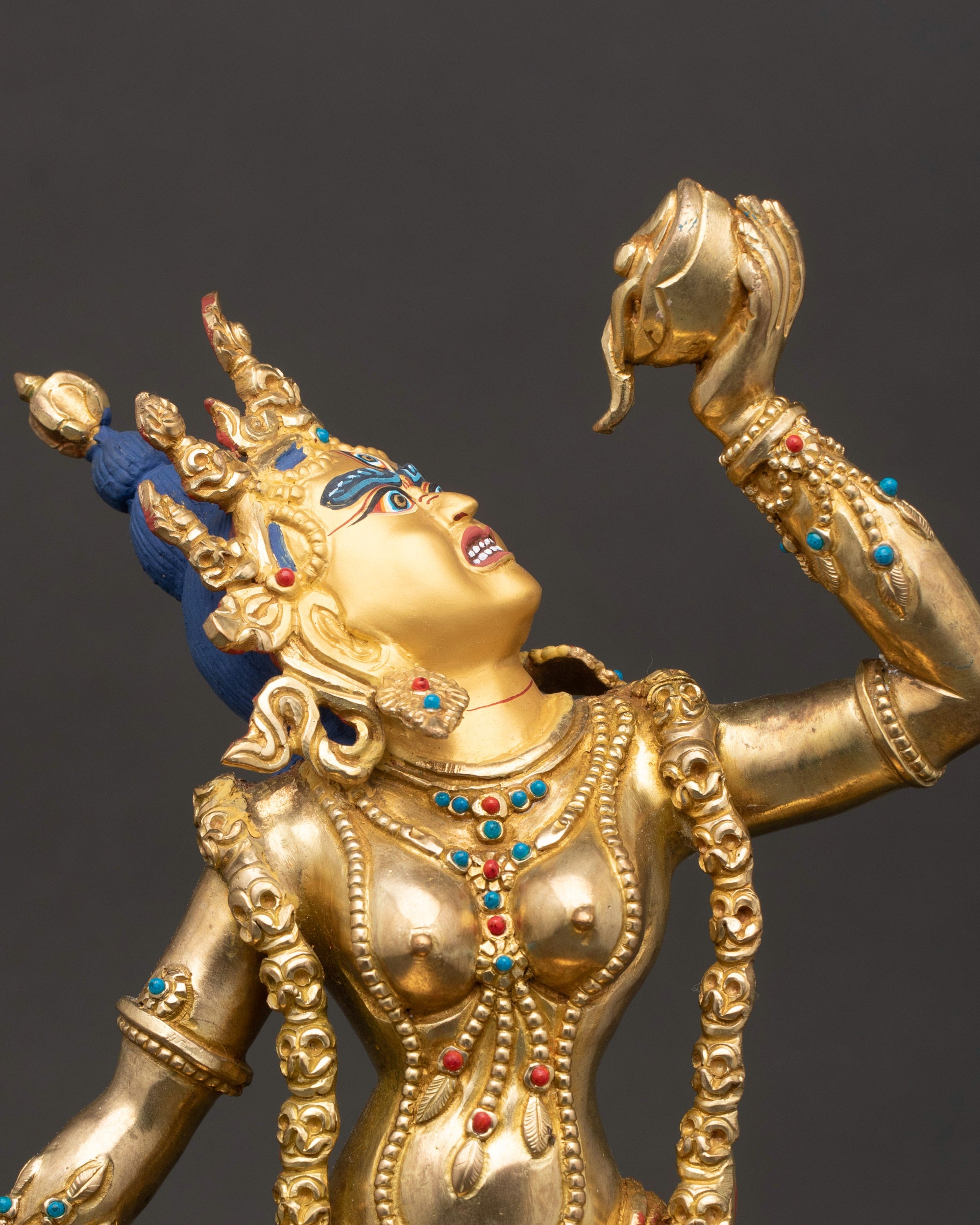 Close-up of Vajrayogini deity holding kartika knife and kapala, detailed Himalayan sculpture