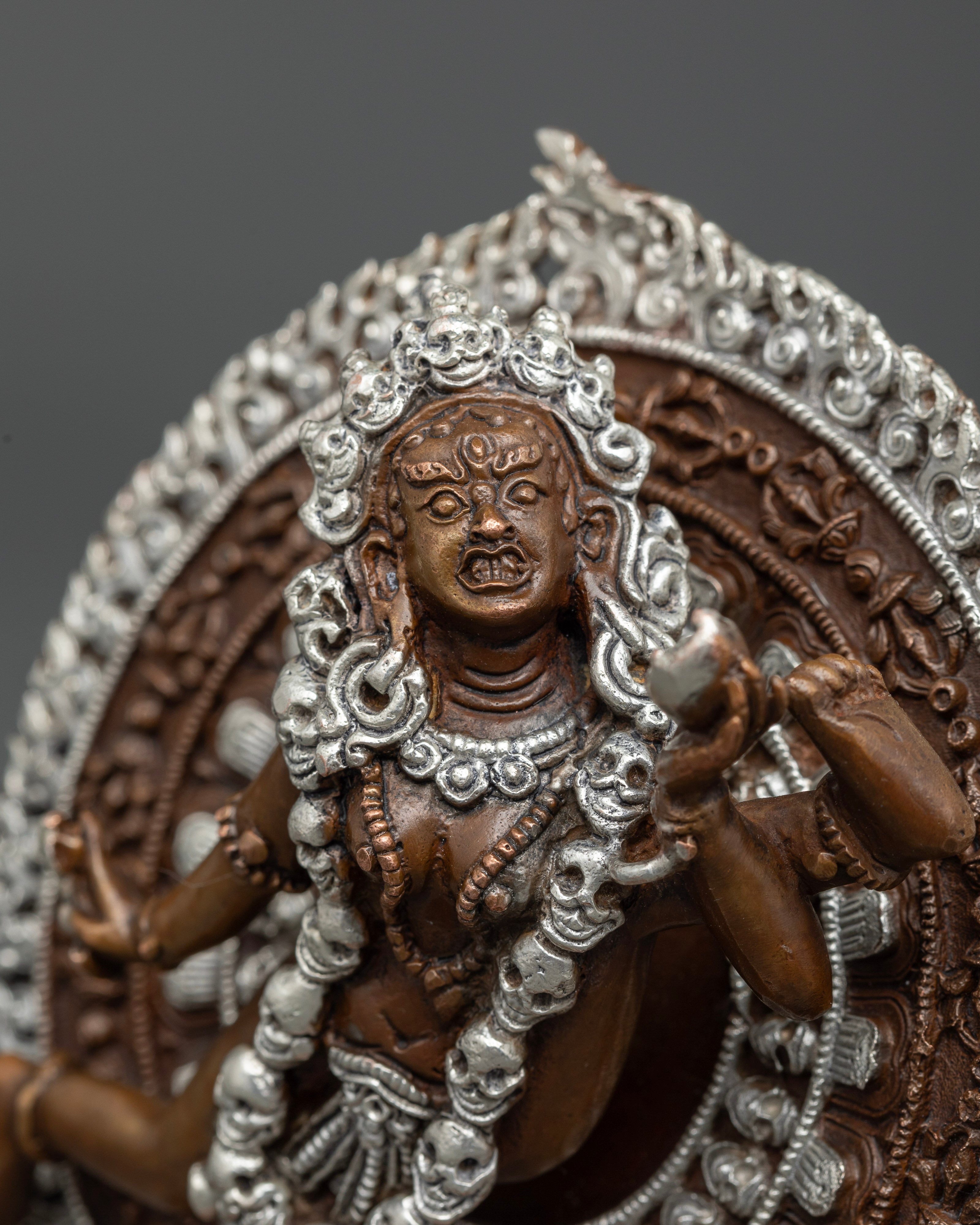 Close-up of Vajrayogini deity statue showing dynamic dancing posture and sacred implements