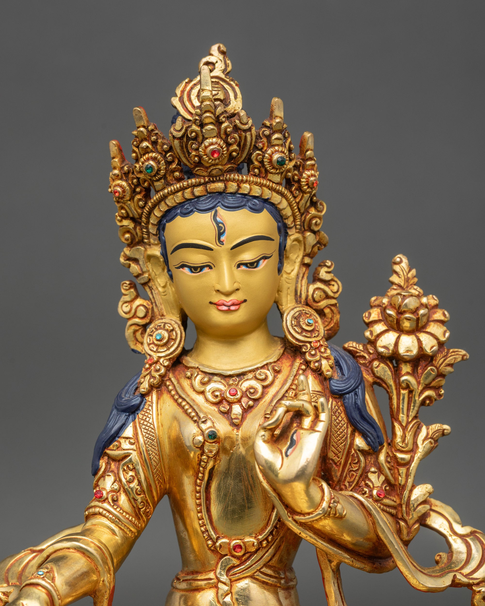 Close-up of White Tara face, seven all-seeing eyes and peaceful expression