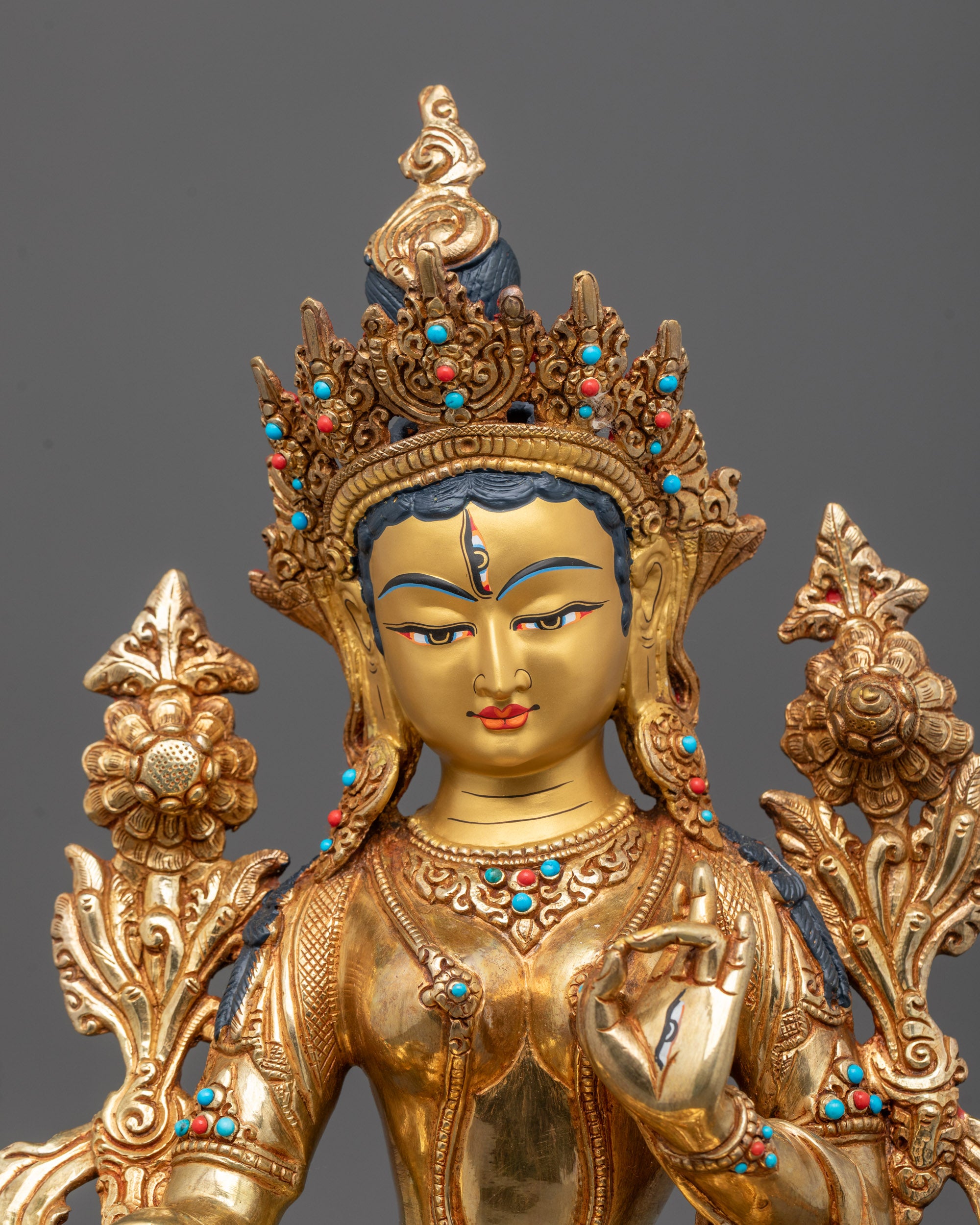 Close-up of White Tara's peaceful face and seven eyes, symbolizing compassionate watchfulness