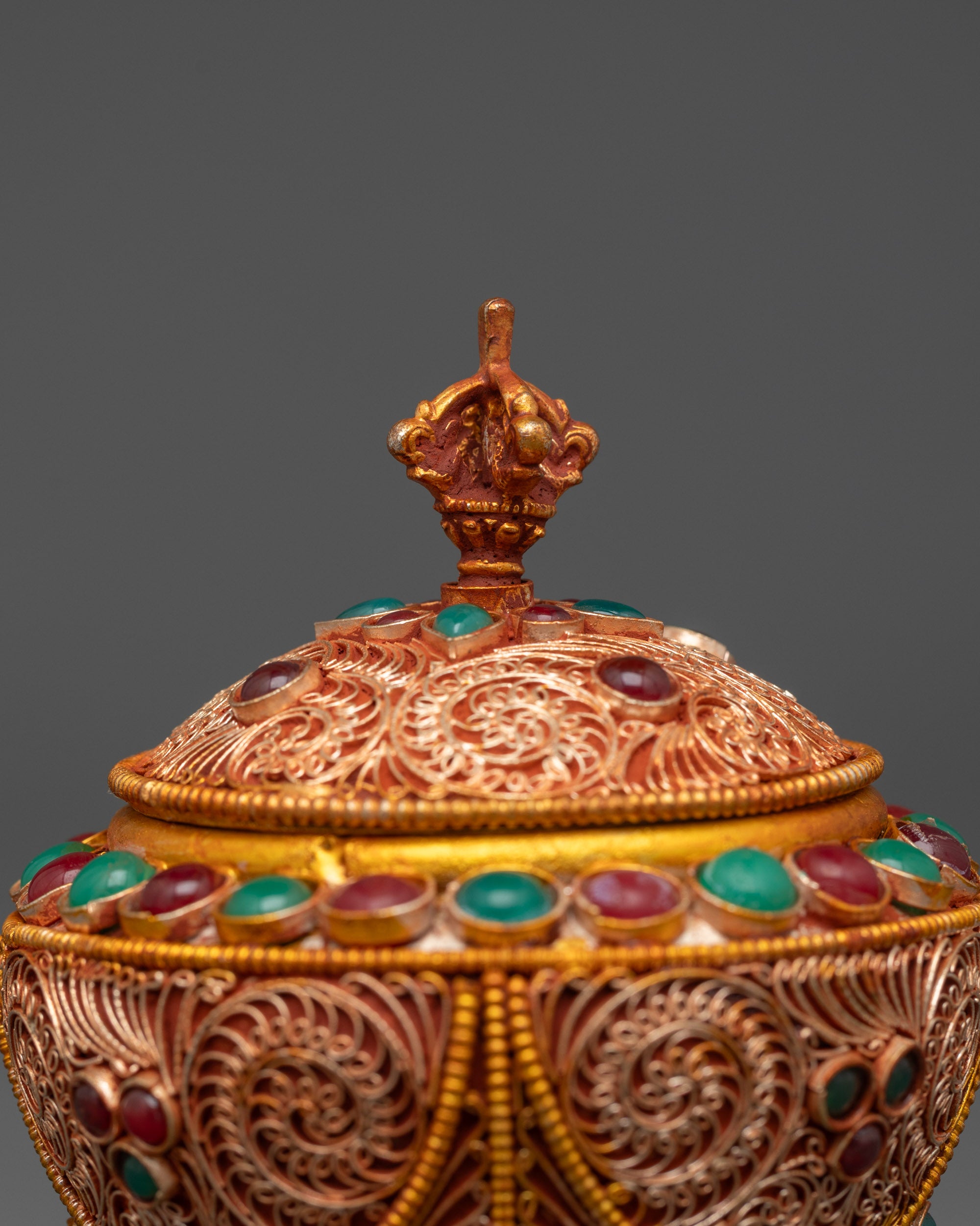 Close-up of emerald and coral stones on handcrafted Nepalese Gulpa Rice Pot