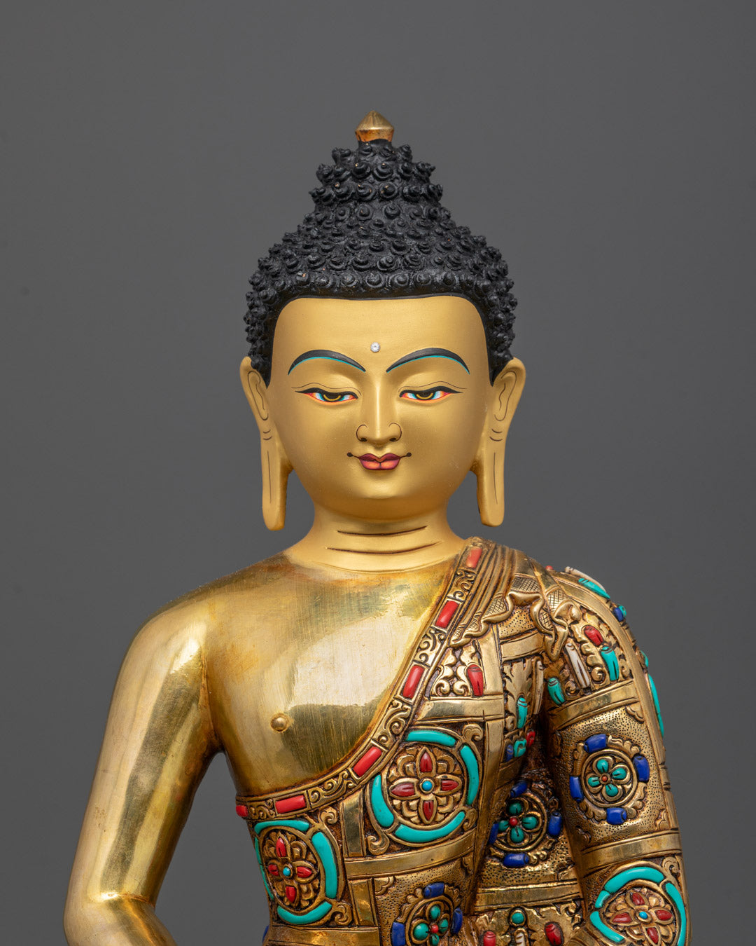 Close-up of intricate carvings and coral stones on Amitabha Tathagata Buddha statue
