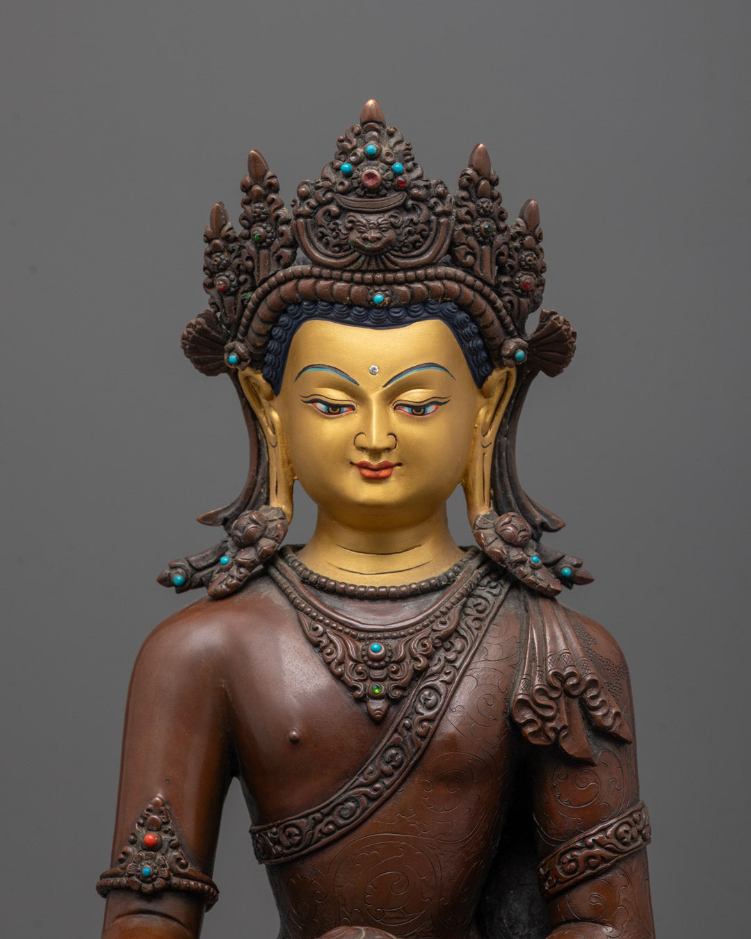 Close-up of intricate crown and jewelry carvings on Oxidized Shakyamuni Buddha statue