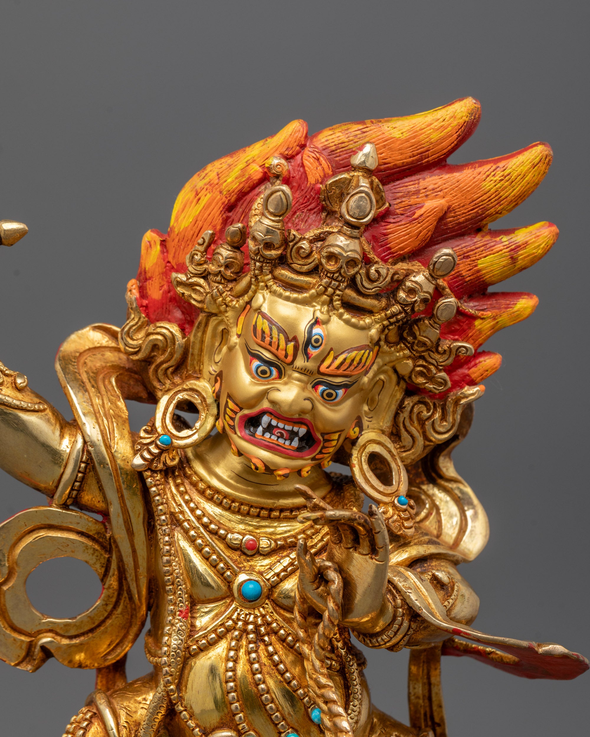 Close-up of intricate details on hand-crafted Vajrapani Buddha statue