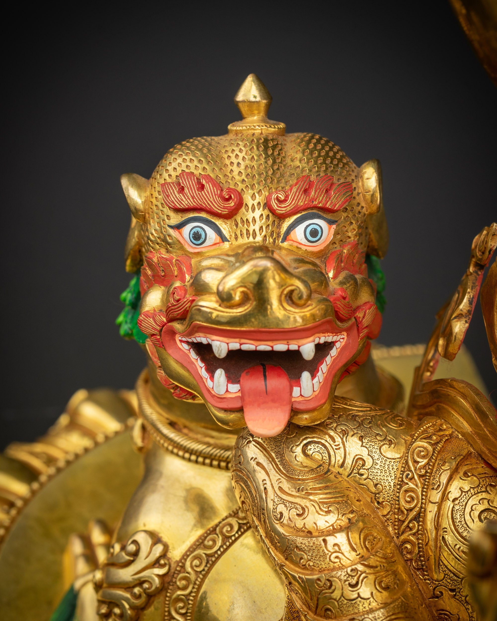 Close-up of snow lion beneath Simhada Manjushri statue showing detailed carving