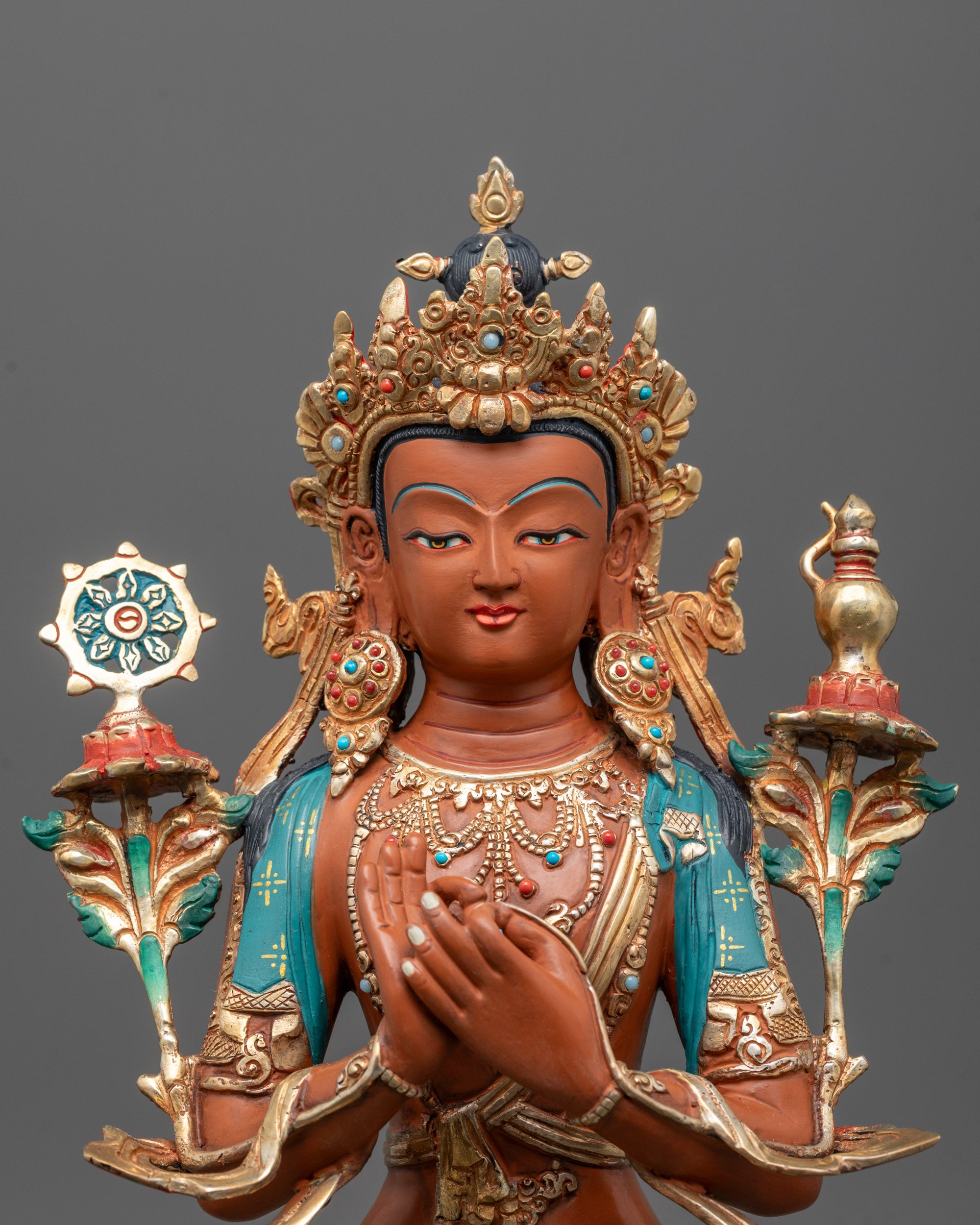 Close-up of the Maitreya Buddha face with red acrylic detailing, showcasing fine craftsmanship