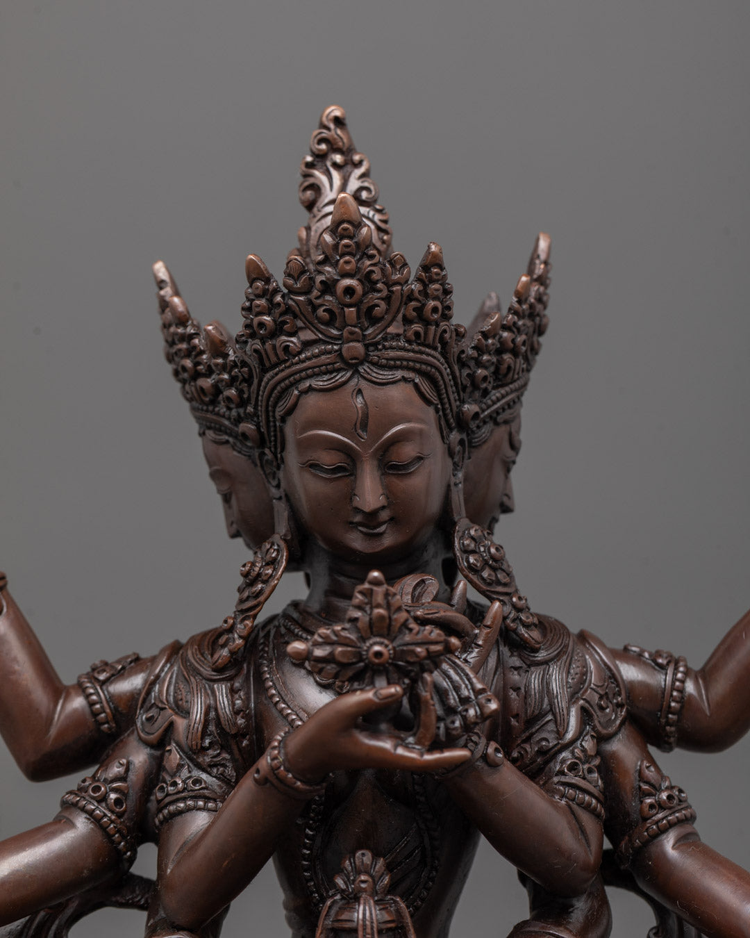 Close-up of the oxidized copper Namgyalma statue showing fine craftsmanship